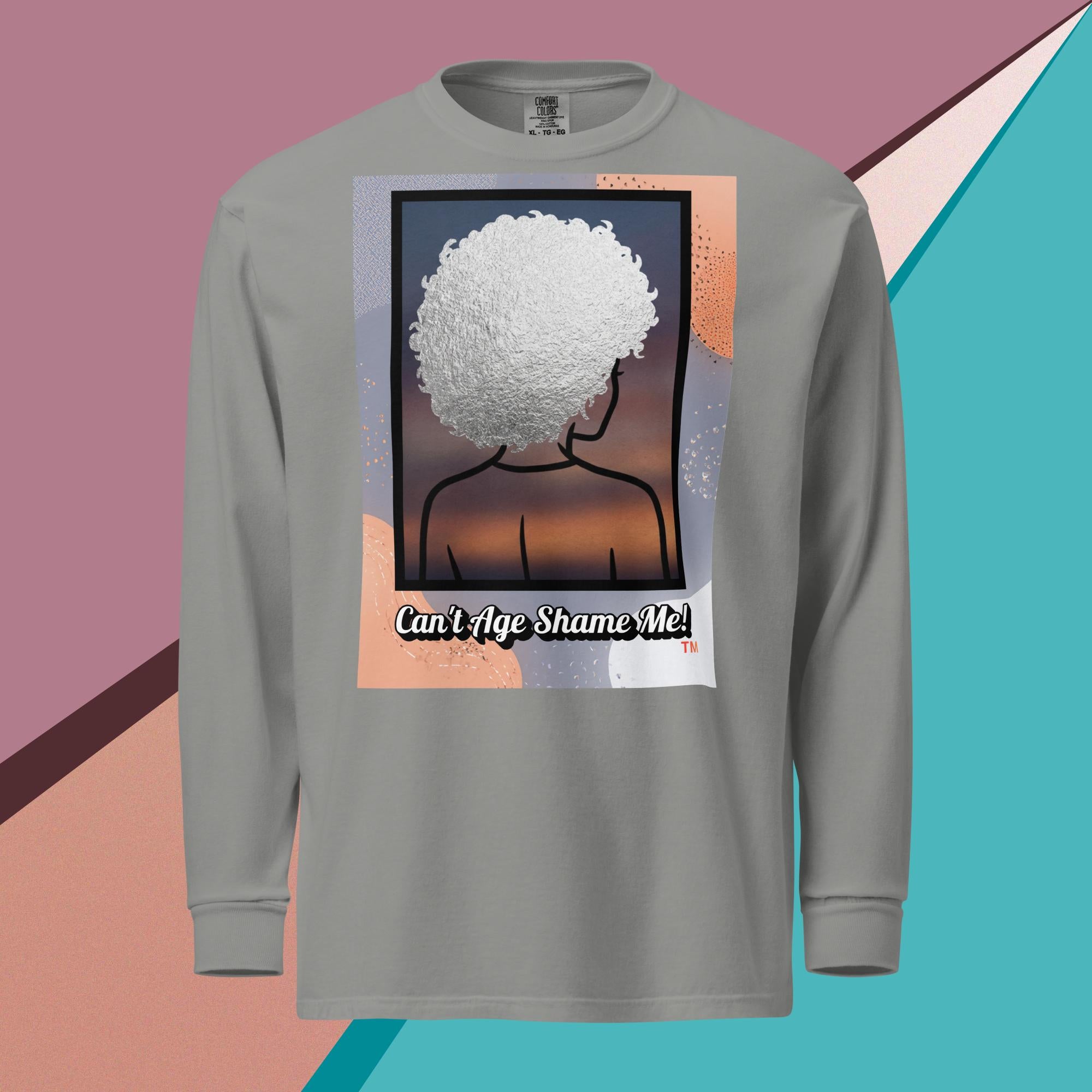 Gray long-sleeve shirt with a graphic design of a person with textured hair and text 'Can't Age Shame Me!' on a colorful background.