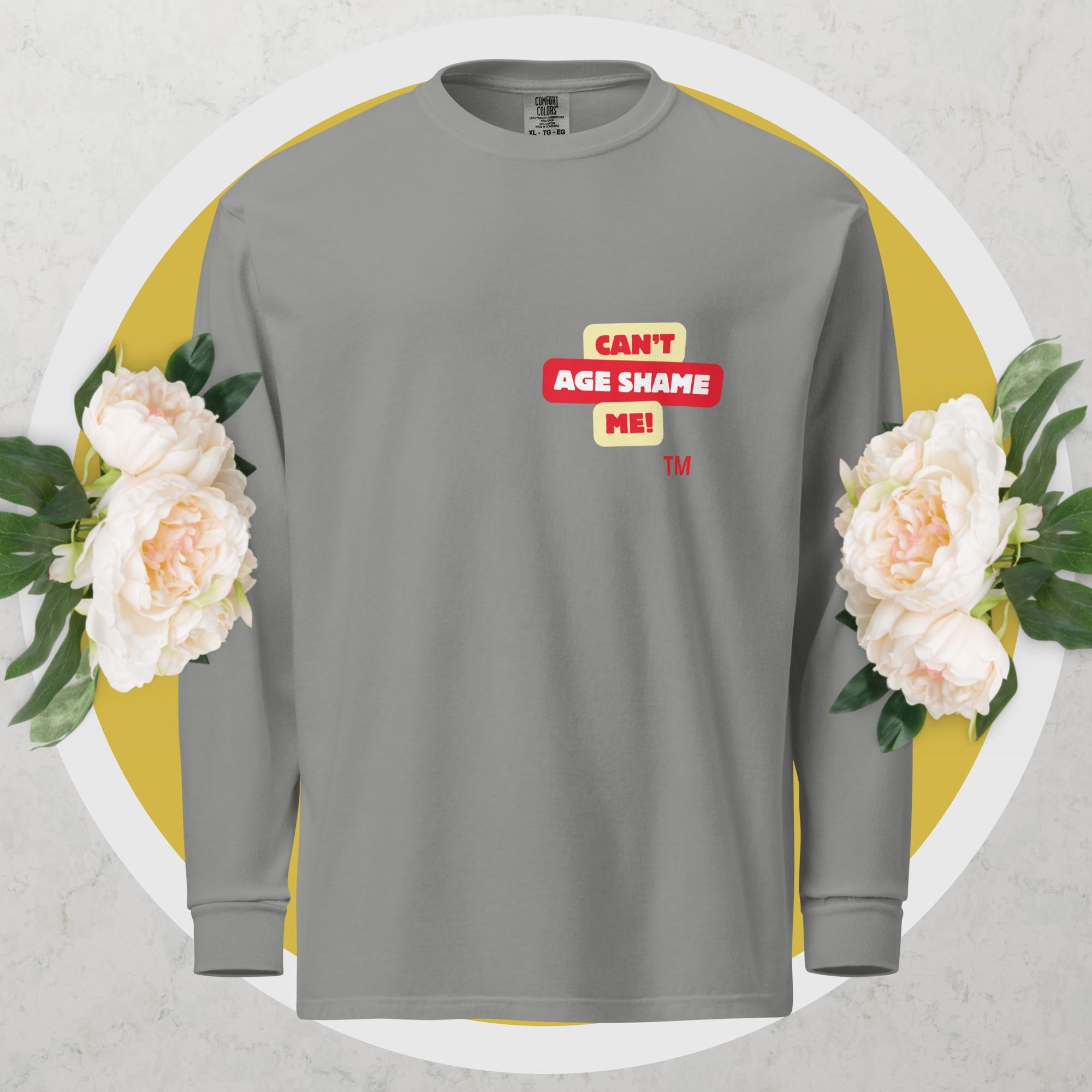 Gray  long-sleeve shirt with a red and yellow logo text graphic: 'CAN'T AGE SHAME ME!
 on a floral background

