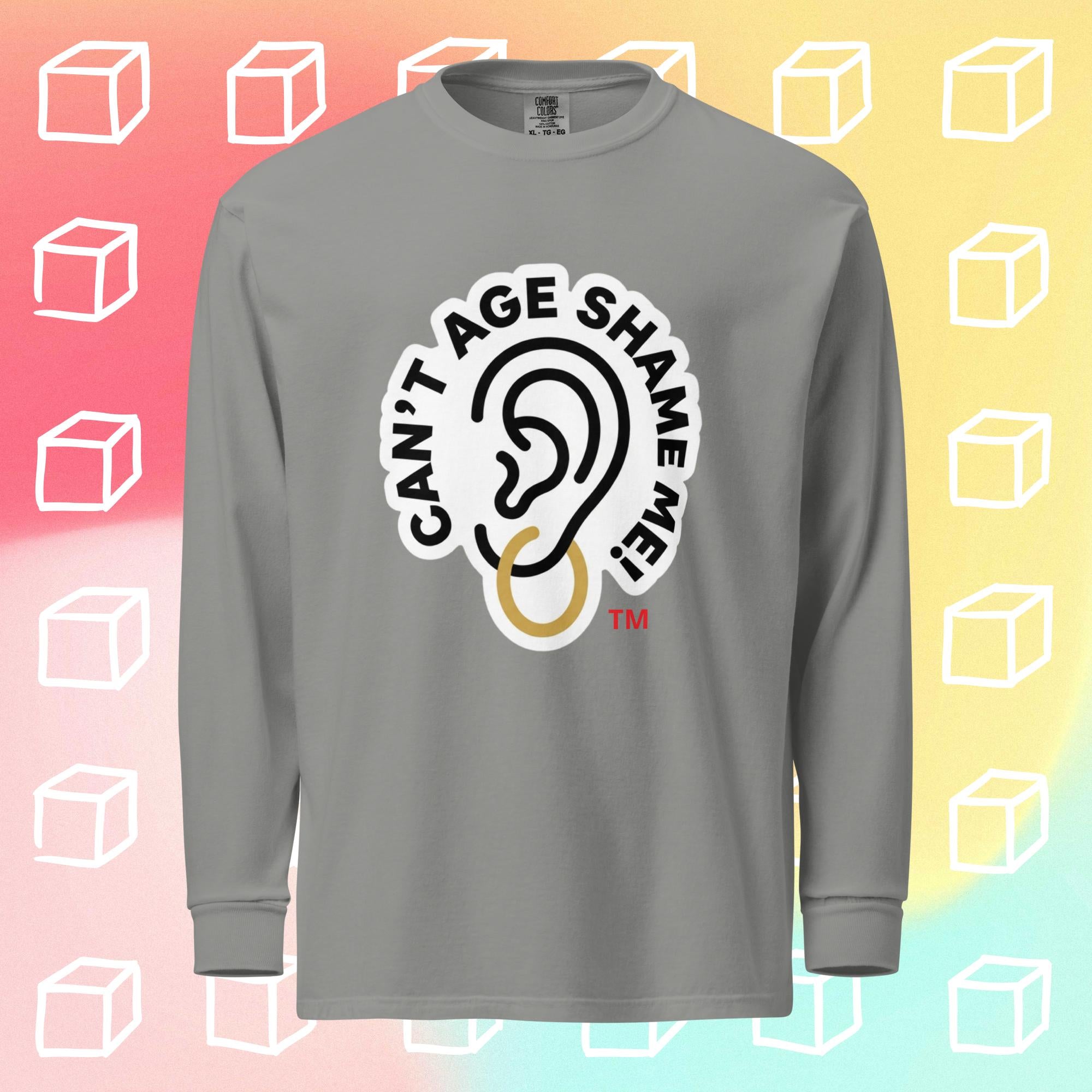 Gray long-sleeve shirt with 'Can't Age Shame Me' graphic on a colorful background with white cube outlines.