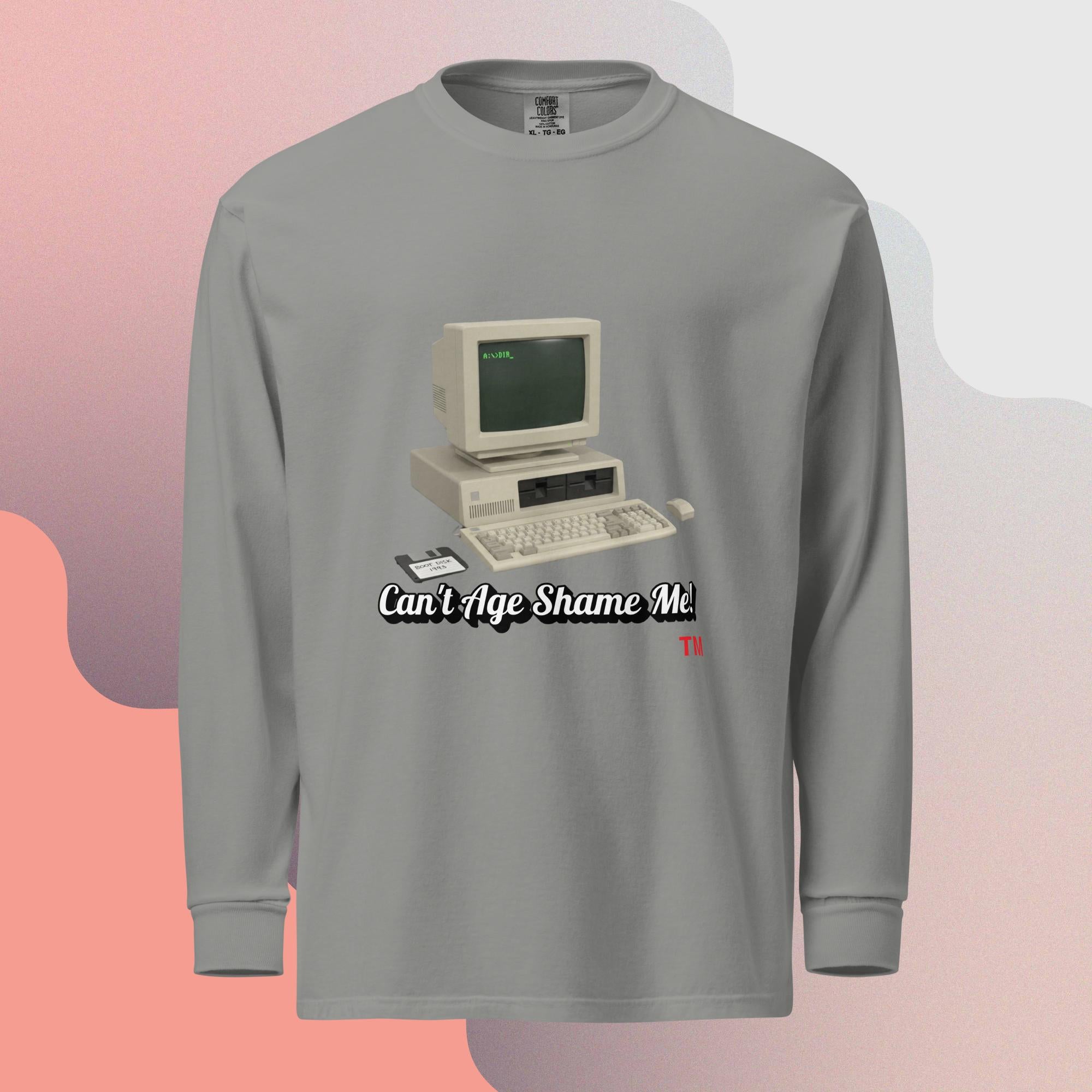 gray long-sleeve shirt with a vintage computer graphic and text  can't age shame me on a gradient background