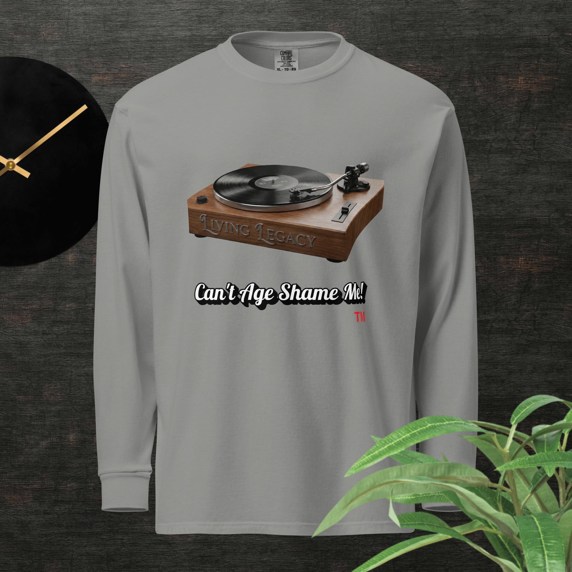 Gray long-sleeve shirt with a graphic of a turntable and text can't age shame me! on a dark background