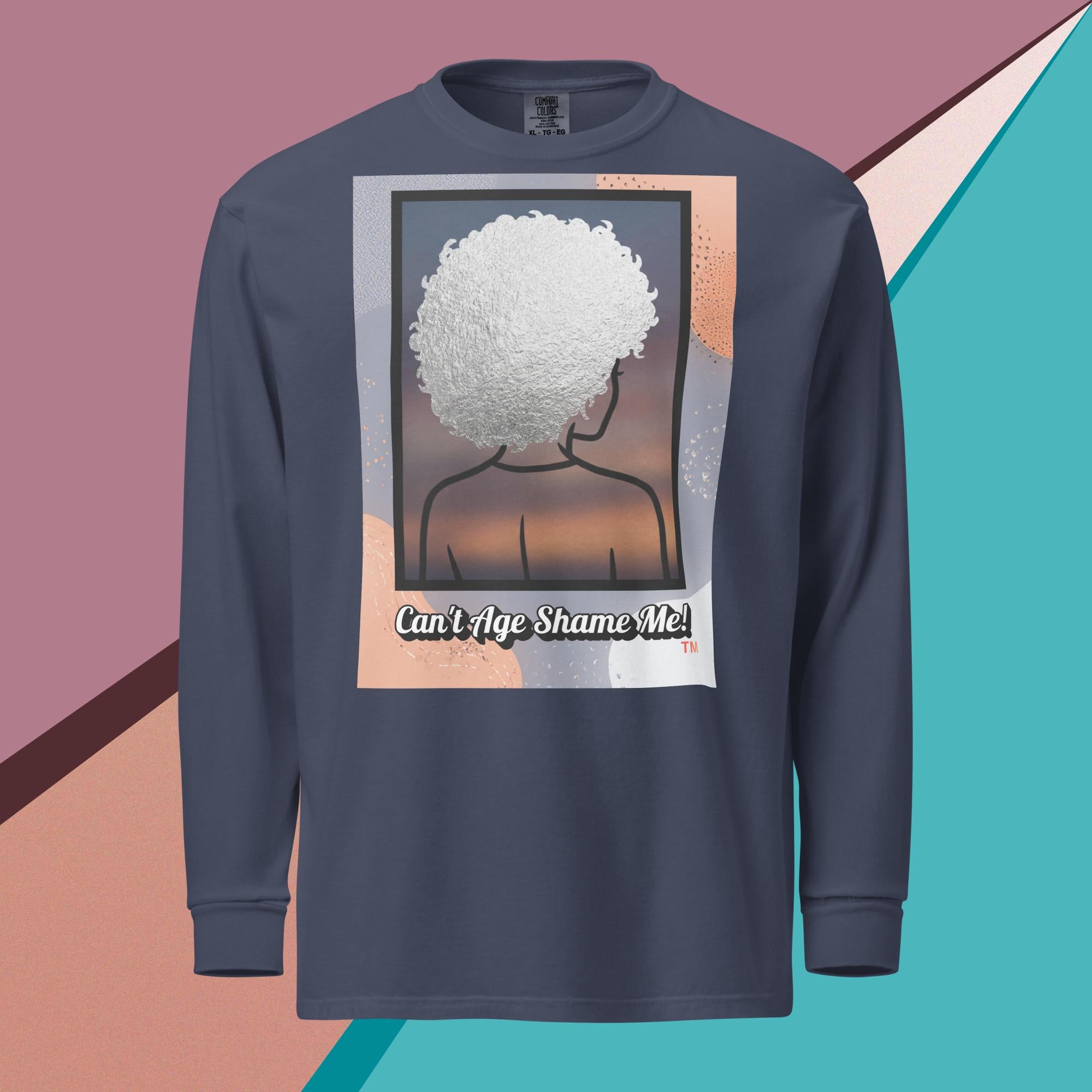 Blue Jean long-sleeve shirt with a graphic design of a person with textured hair and text 'Can't Age Shame Me!' on a colorful background.