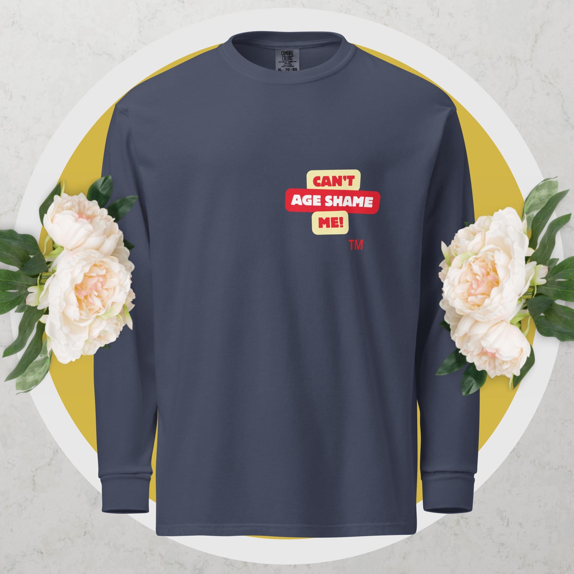 Navy long-sleeve shirt with a red and yellow logo text graphic: 'CAN'T AGE SHAME ME!
 on a floral background

