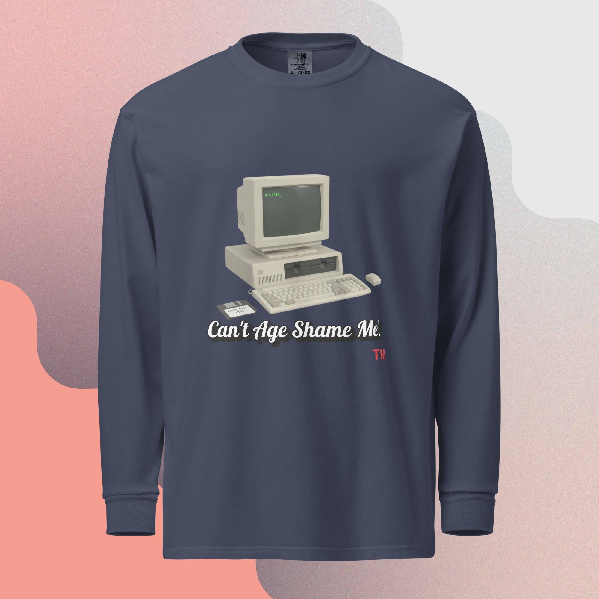 navy long-sleeve shirt with a vintage computer graphic and text  can't age shame me on a gradient background