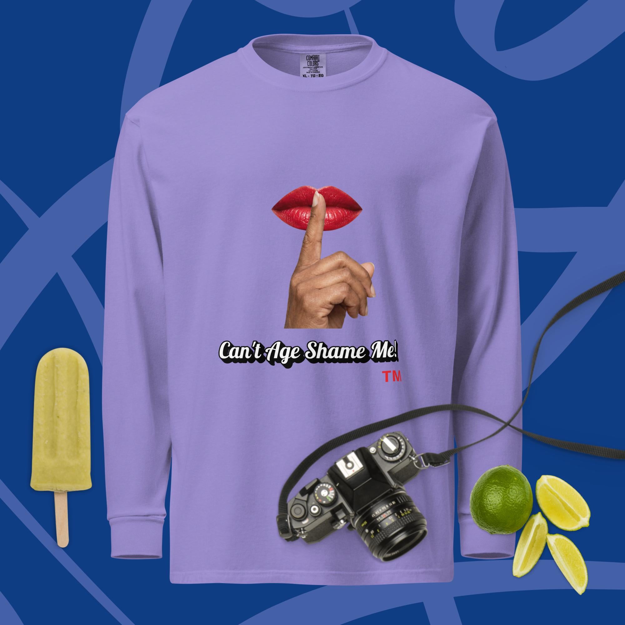 Violet long-sleeve shirt with a graphic design of lips and a finger on a blue background