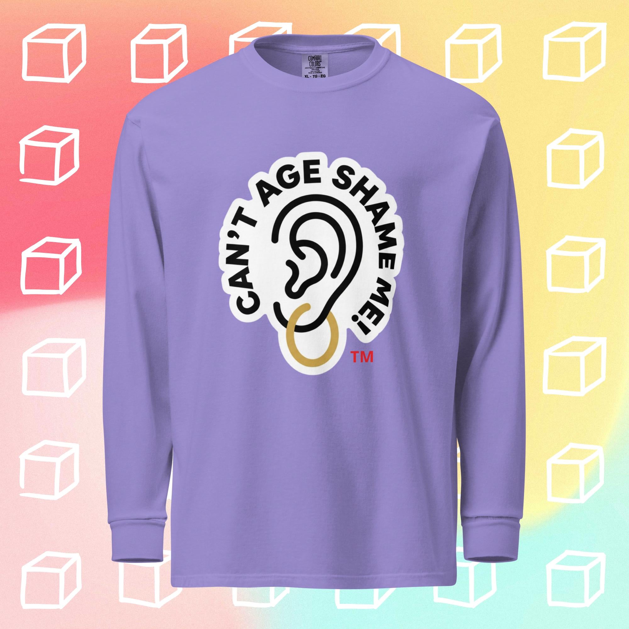 Violet long-sleeve shirt with 'Can't Age Shame Me' graphic on a colorful geometric background