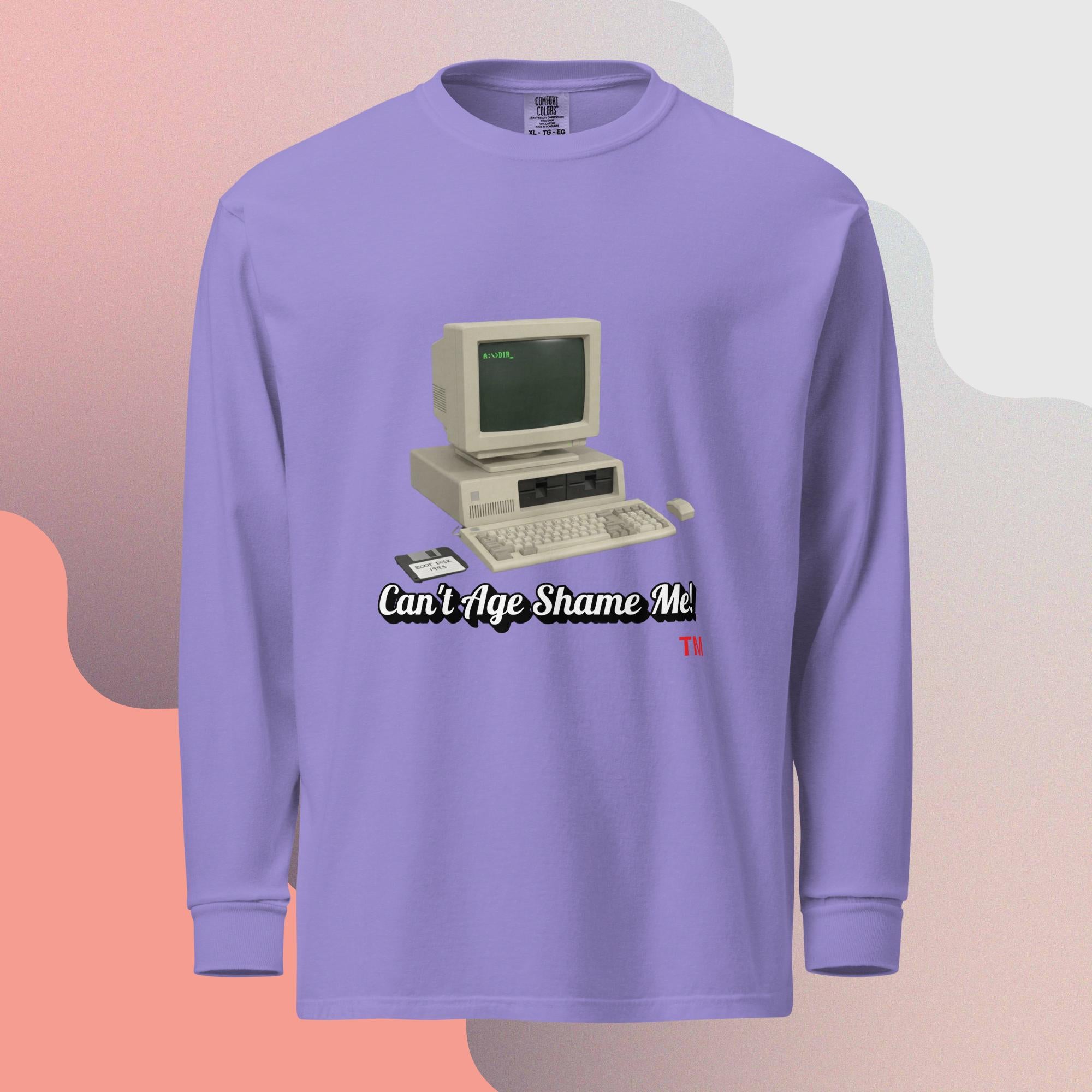 violet  long-sleeve shirt with a vintage computer graphic and text  can't age shame me on a gradient background