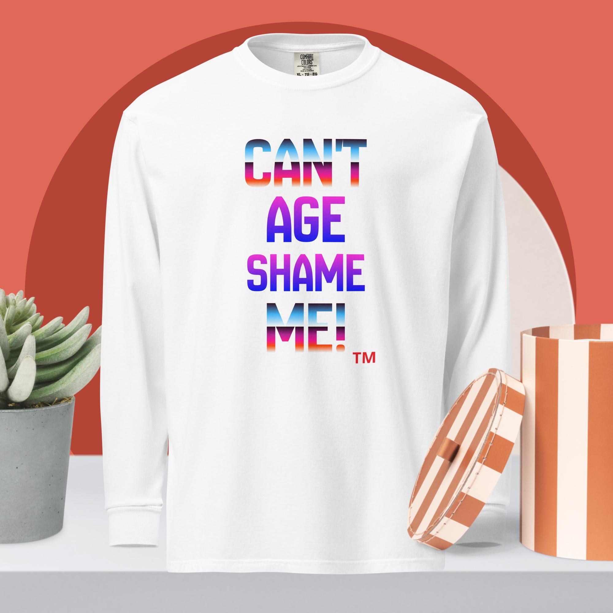 White sweatshirt with colorful text 'CAN'T AGE SHAME ME!' on a red background