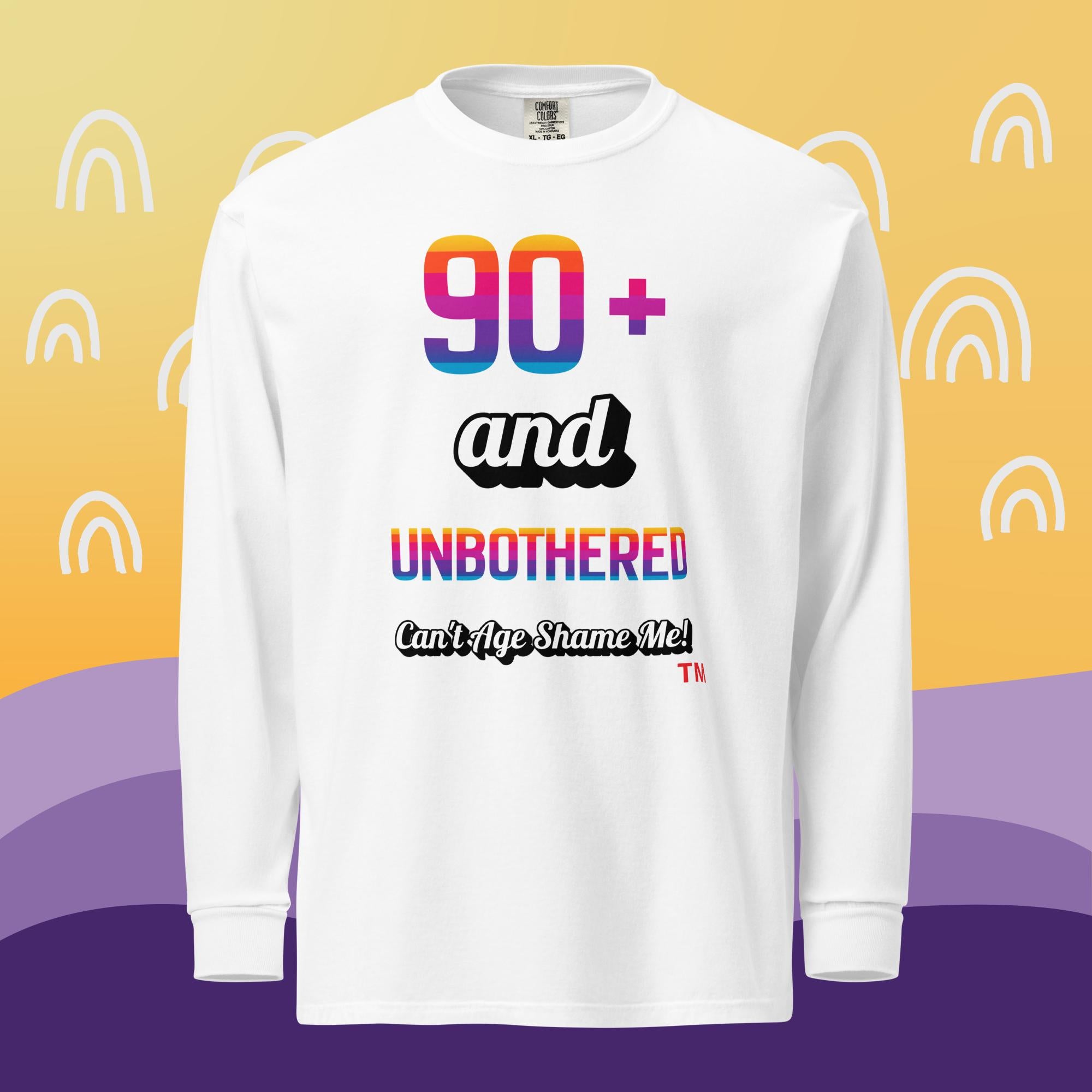 White long-sleeve shirt with colorful text on a yellow and purple background