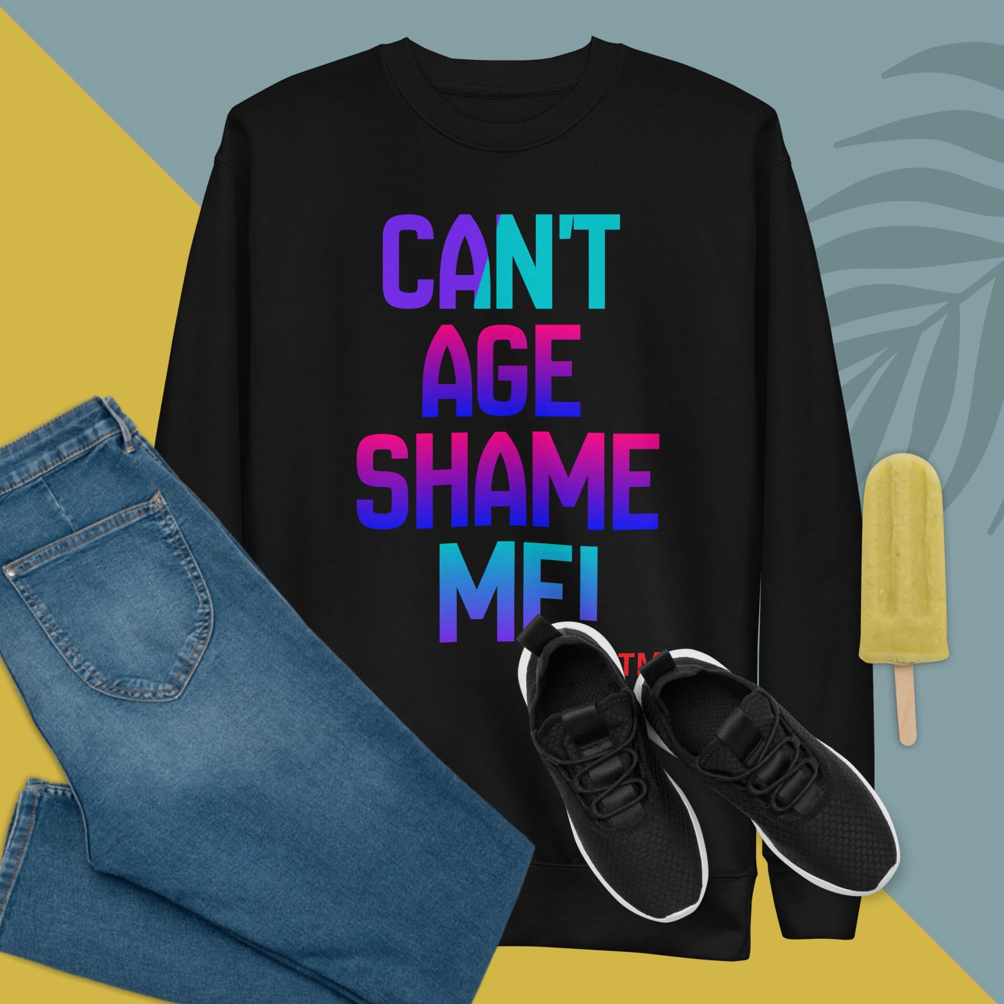 Black sweatshirt with colorful text, blue jeans, black sneakers, and a popsicle on a multicolored background