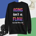 Black sweatshirt with colorful text 'AGING isn't a FLAW. Can't Age Shame Me!' on a blue and green background.