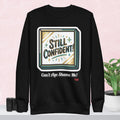 Black hoodie with 'Still Confident' graphic on a colorful background