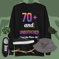 Black sweatshirt with colorful text, black sneakers, gray hat, and branch on a green background