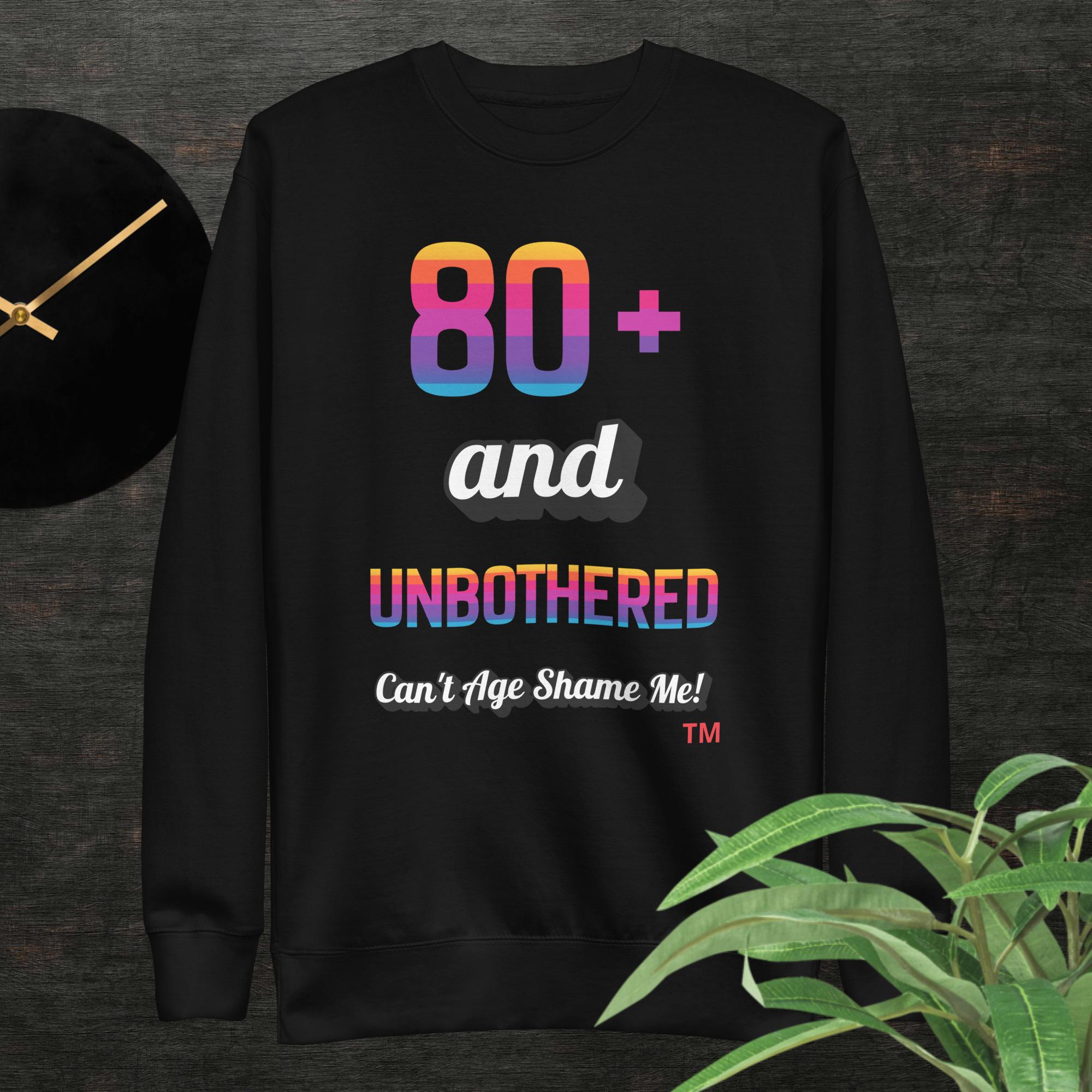 Black sweatshirt with colorful text design on a dark background