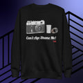 Black sweatshirt with camera graphic and text can't age shame me! on a blue and black striped background.