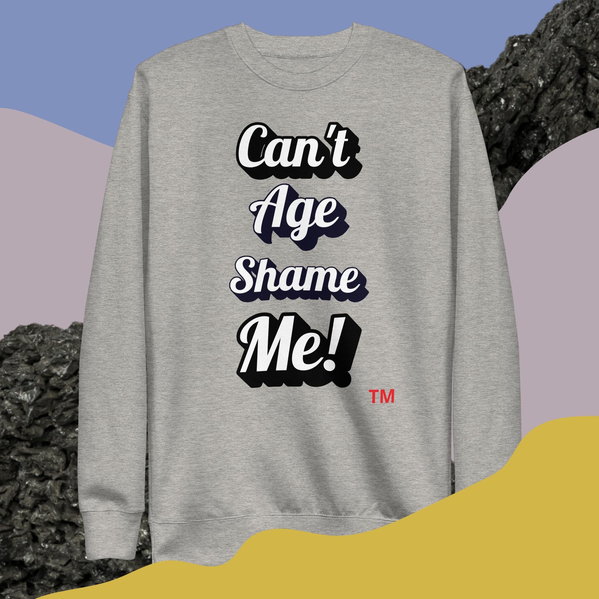 Gray sweatshirt with 'Can't Age Shame Me!' text on a colorful background