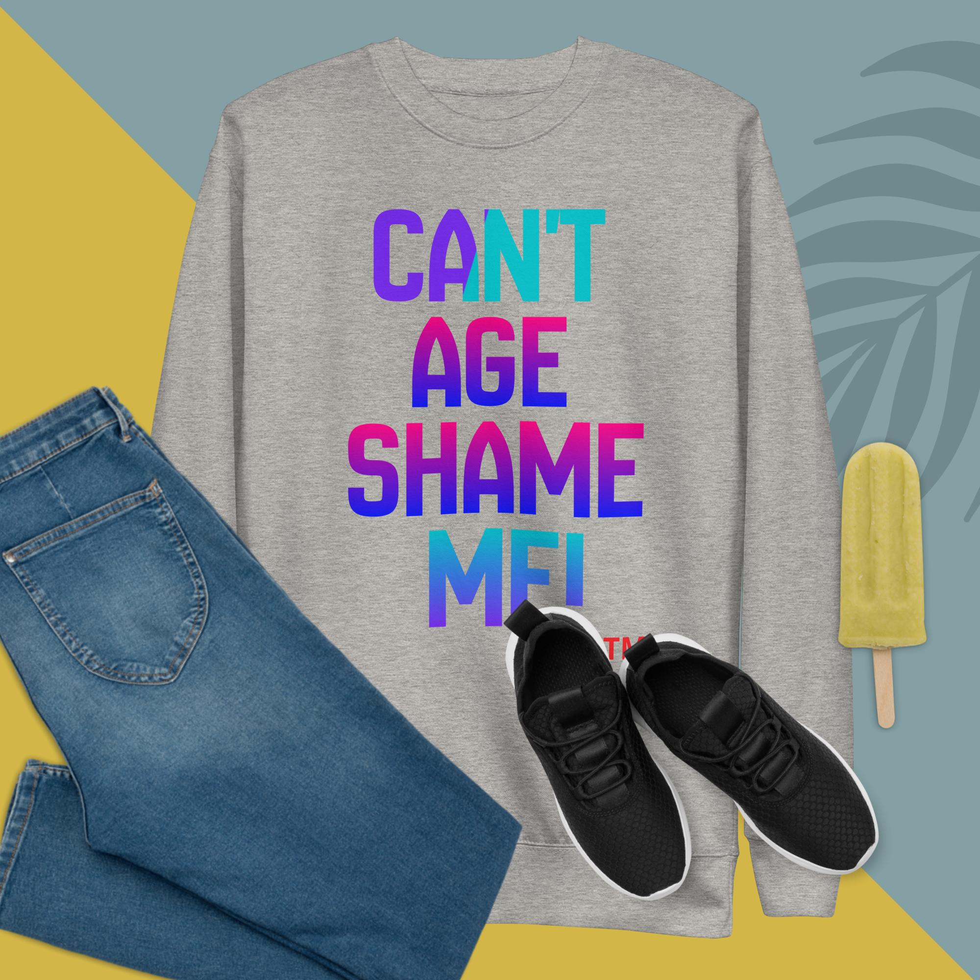 Gray sweatshirt with colorful text, blue jeans, black sneakers, and a popsicle on a geometric background