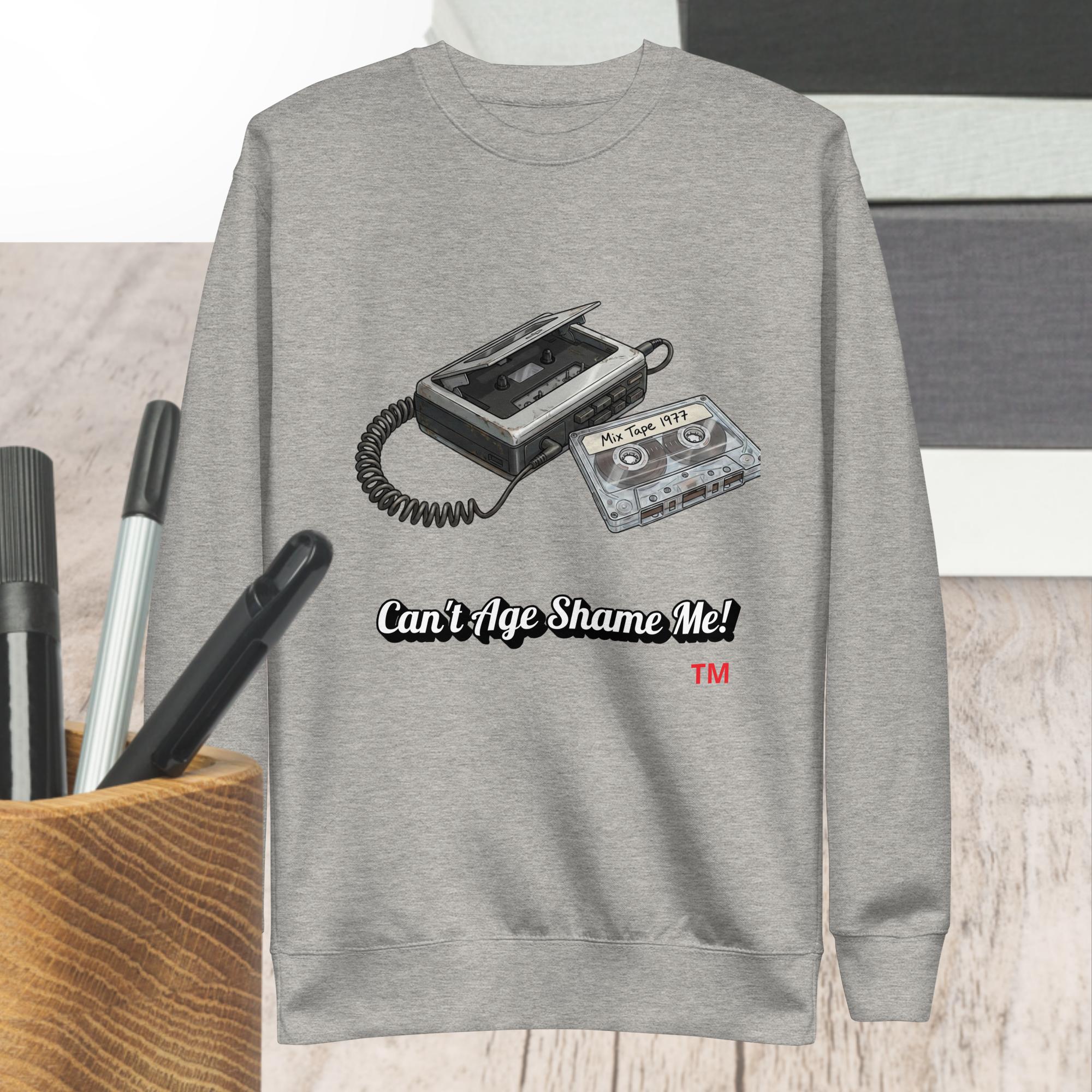 carbon gray sweatshirt with cassette tape design and text 'Can't Age Shame Me!' on a neutral background.