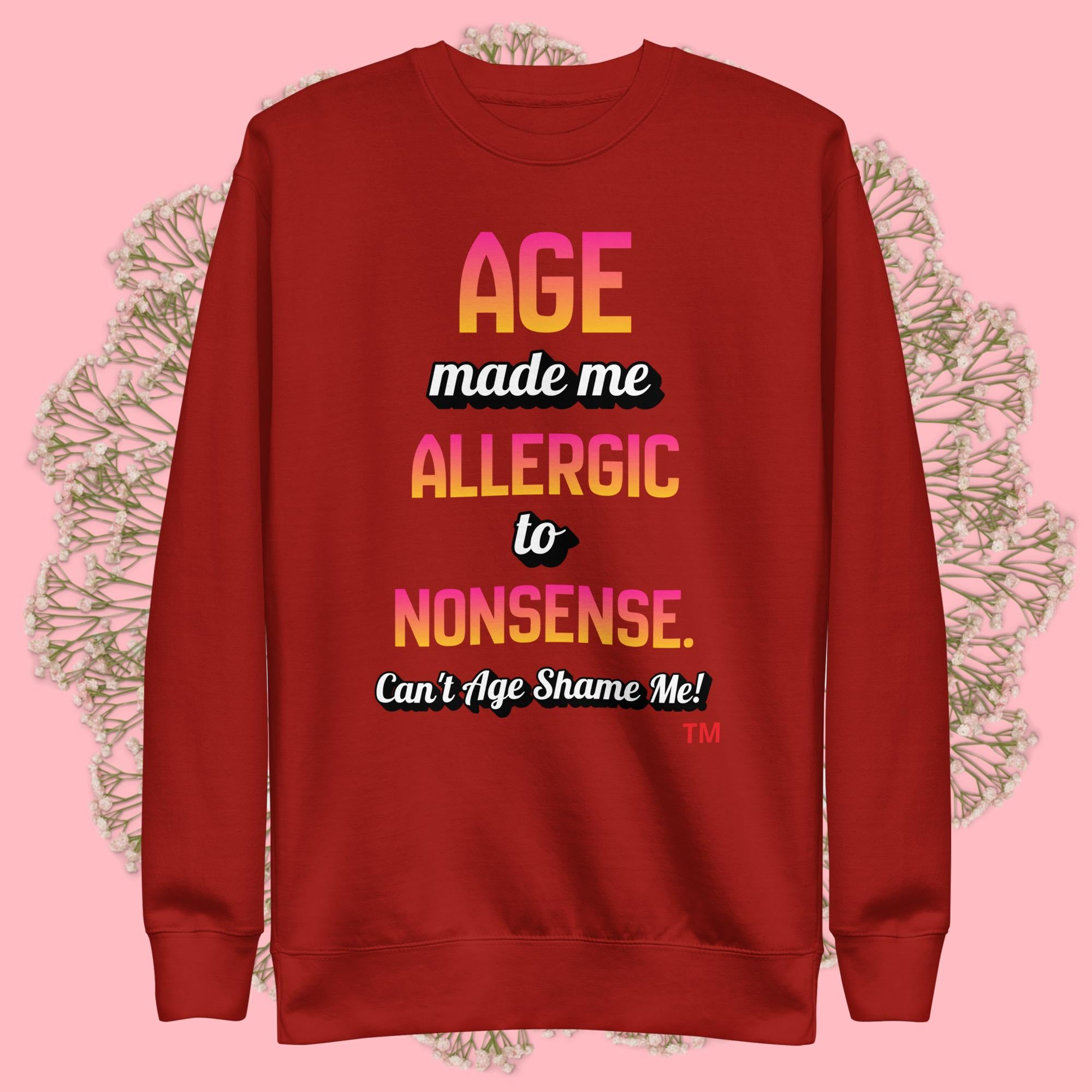 Cardinal  sweatshirt with colorful text on a pink background