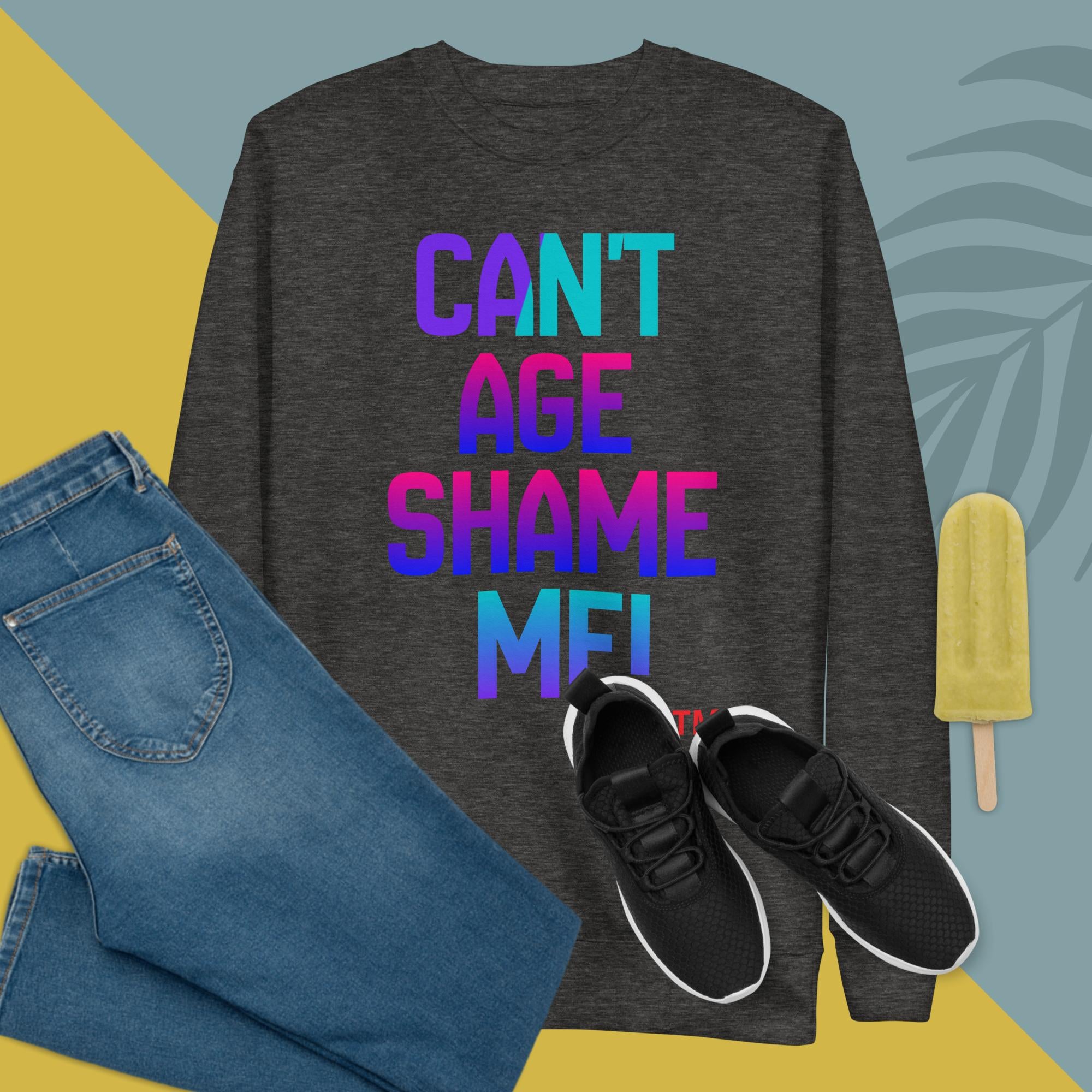 Dark gray sweatshirt with colorful text, blue jeans, black sneakers, and a popsicle on a multicolored background.