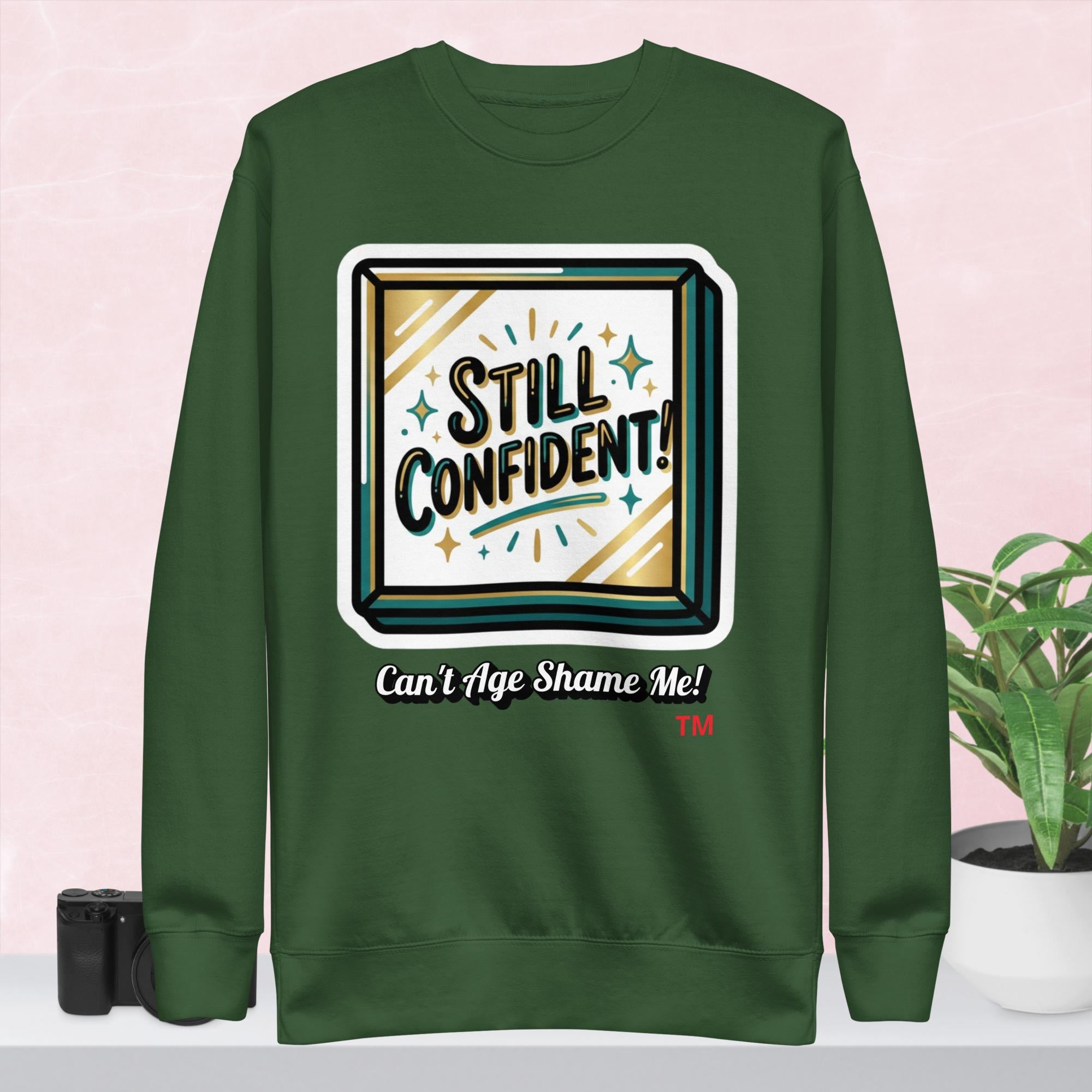 Forest Green hoodie with 'Still Confident' graphic on a colorful background