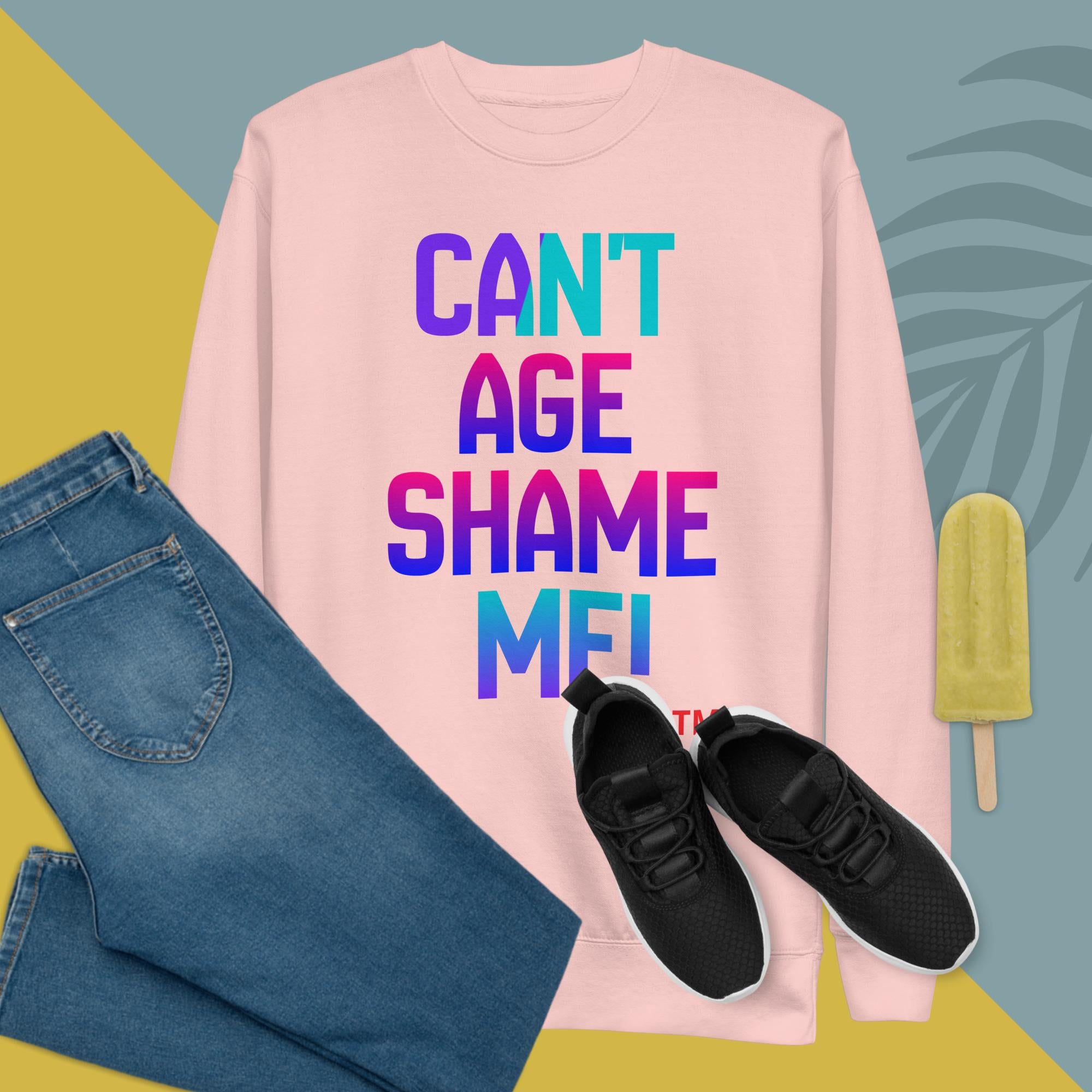 Pink sweatshirt with colorful text, blue jeans, black sneakers, and a popsicle on a multicolored background