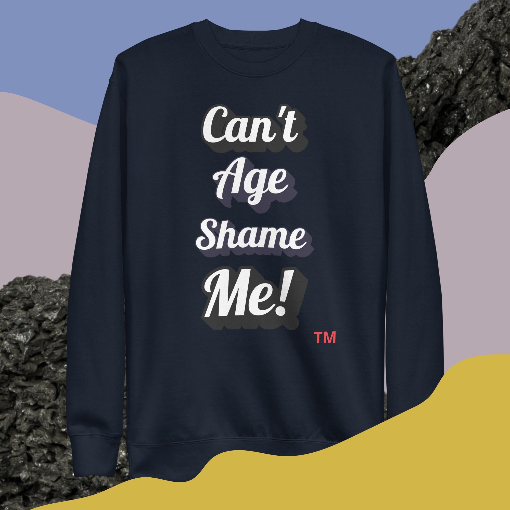 Navy blue sweatshirt with 'Can't Age Shame Me!' text on a colorful abstract background