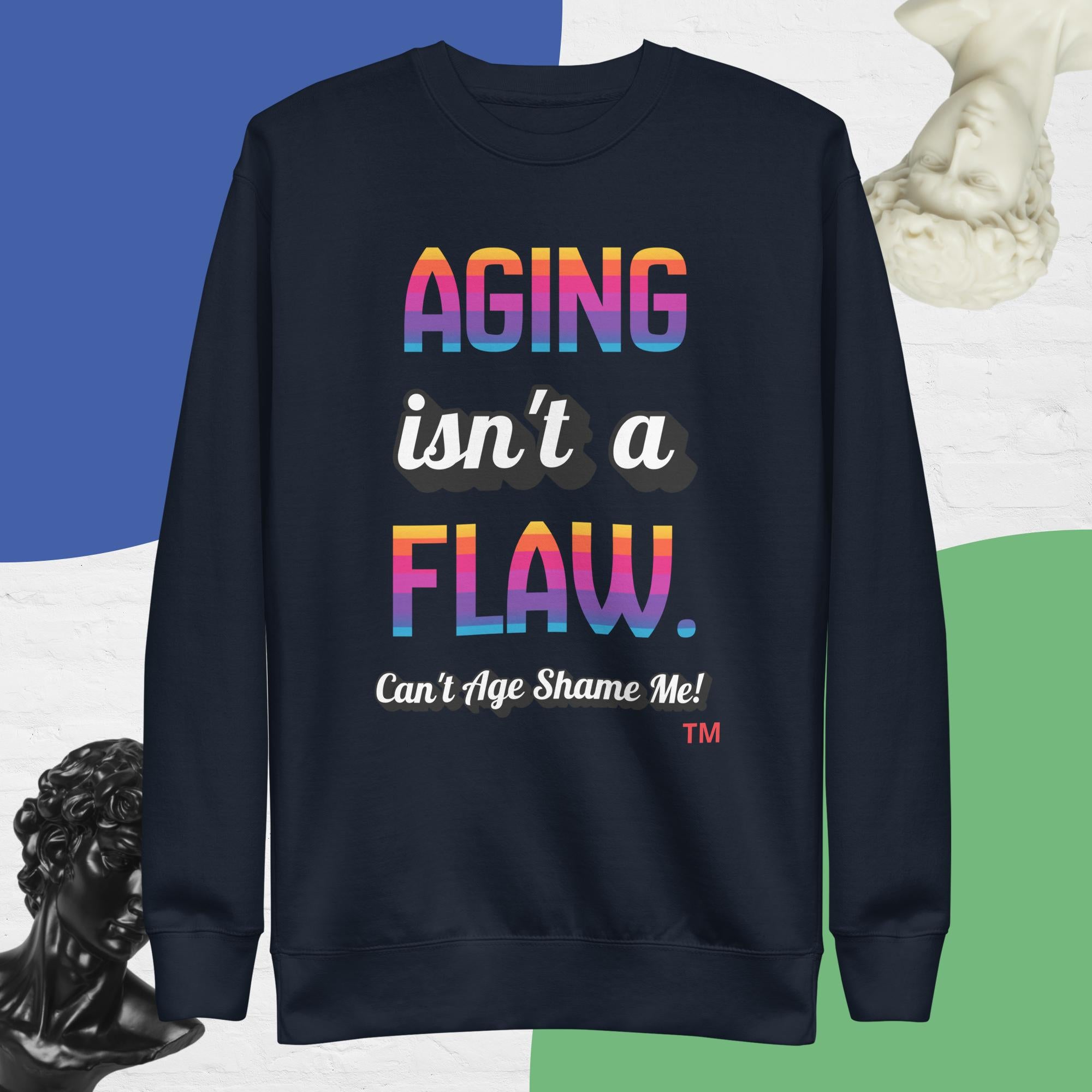 Navy sweatshirt with colorful text 'AGING isn't a FLAW. Can't Age Shame Me!' on a multicolored background.