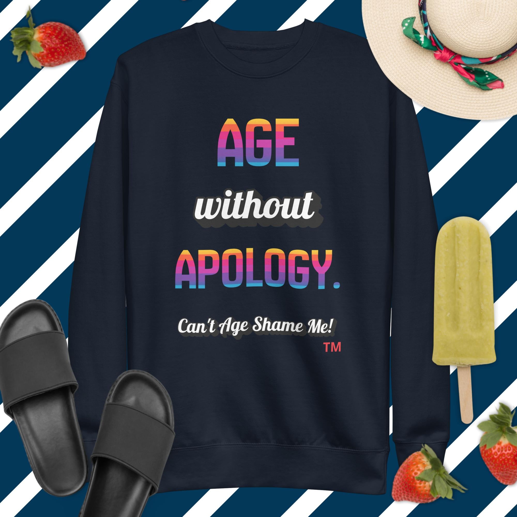 Navy sweatshirt with colorful text on a blue and white striped background with accessories.