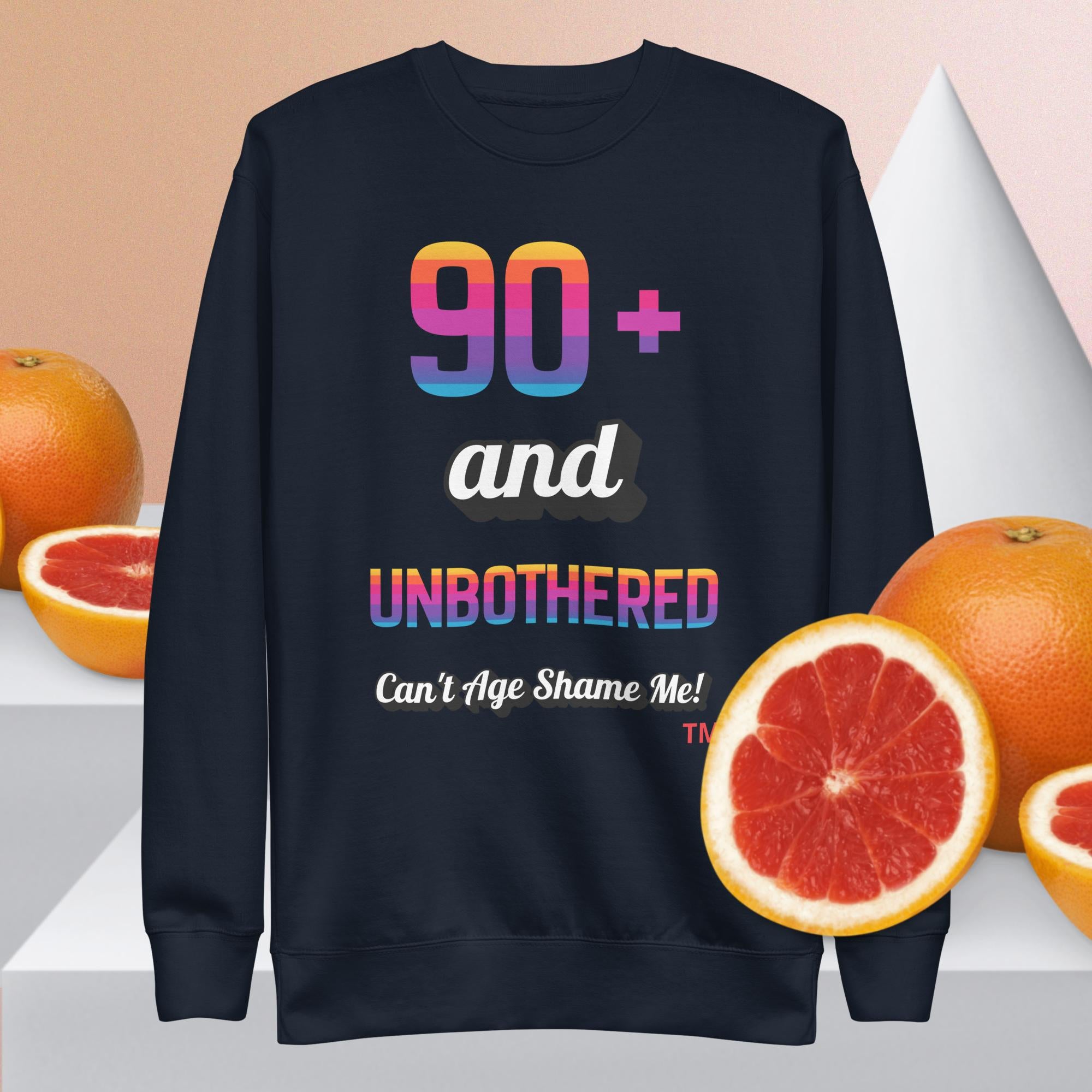 navy sweatshirt with colorful text and grapefruits on a light background