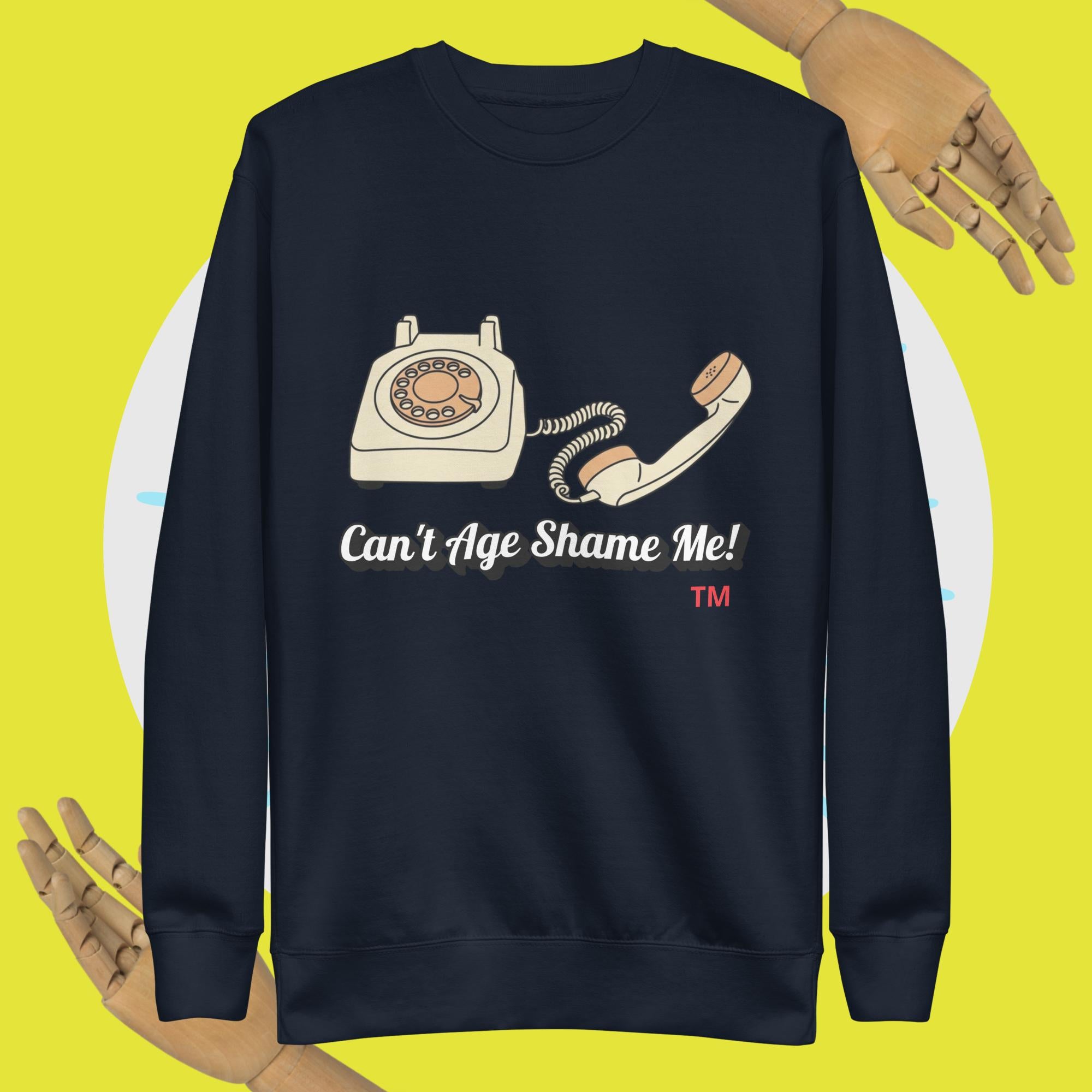 Navy blue sweatshirt with a vintage phone graphic and text 'Can't Age Shame Me!' on a yellow background.