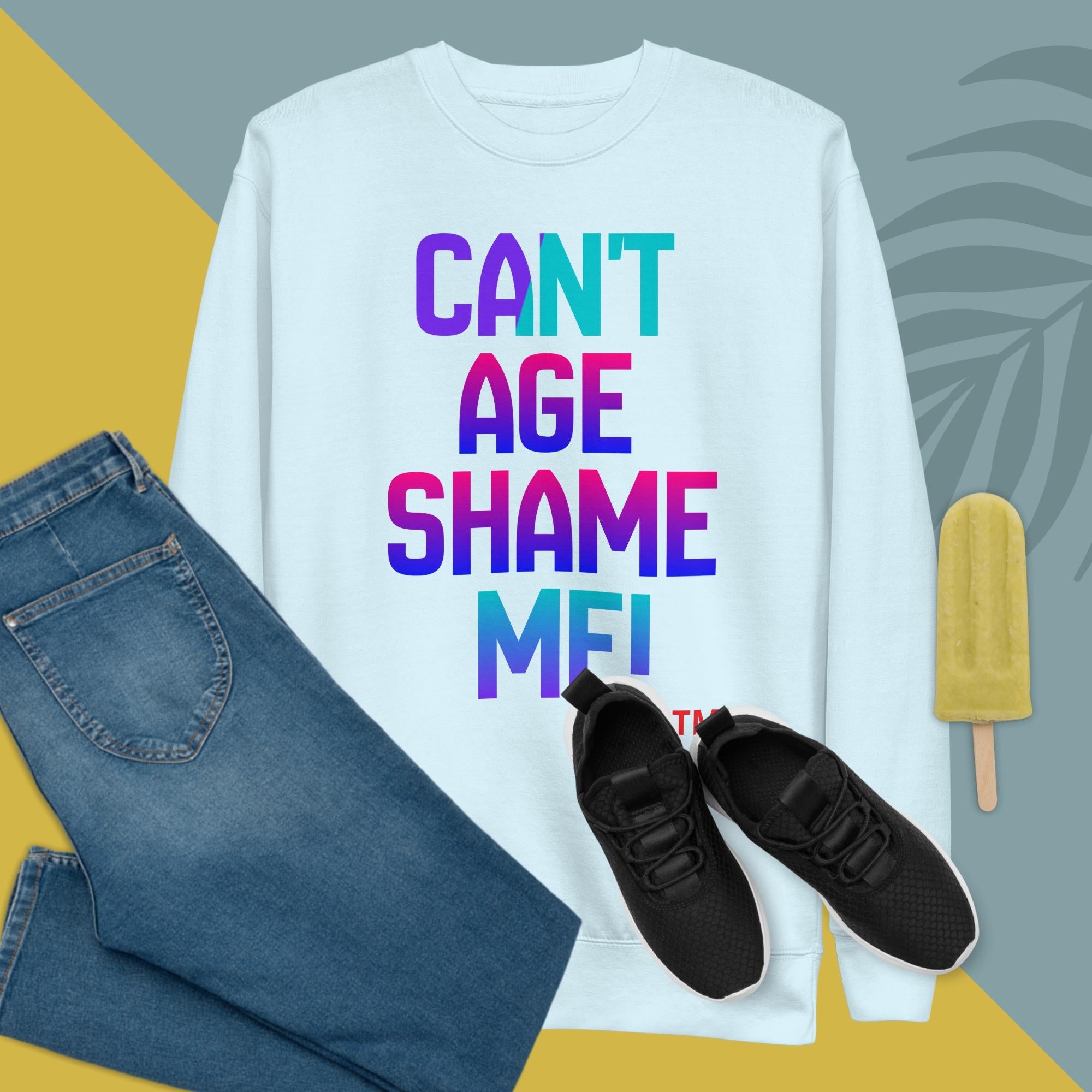 White sweatshirt with colorful text, blue jeans, black sneakers, and a popsicle on a geometric background