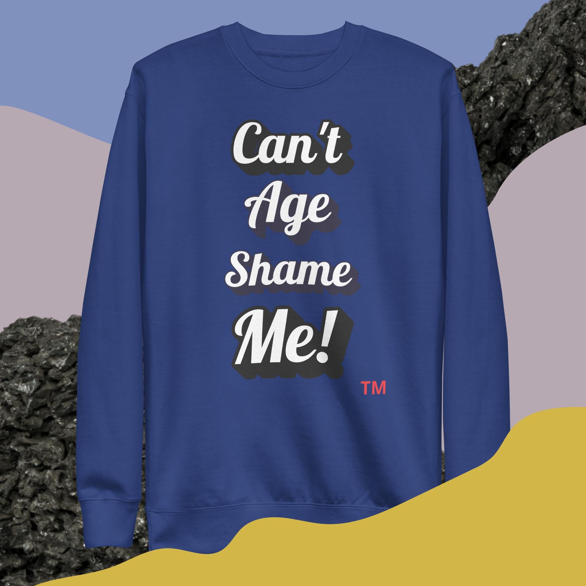 Blue sweatshirt with 'Can't Age Shame Me!' text on a colorful background