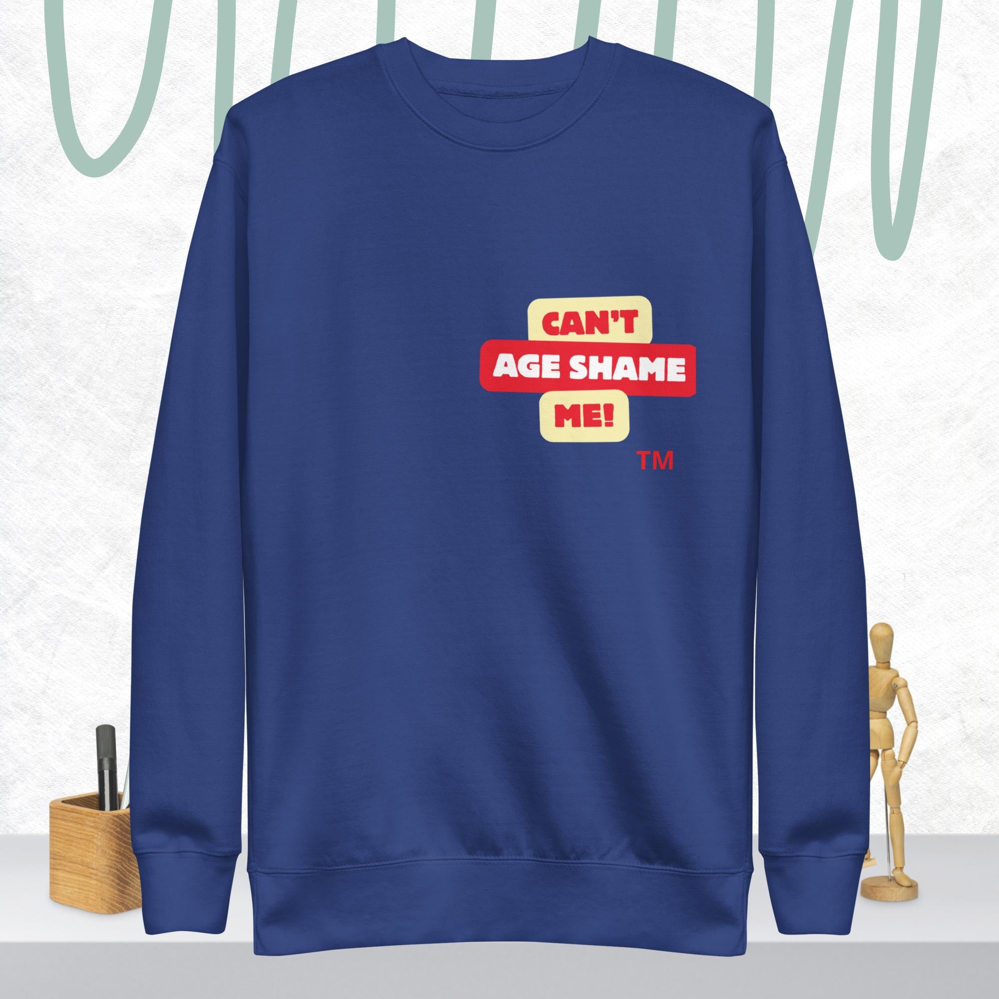 Team Royal sweatshirt with 'CAN'T AGE SHAME ME!' text logo on a light gray background