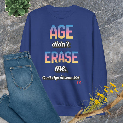 Team royal sweatshirt with colorful text on a stone surface with jeans and flowers.