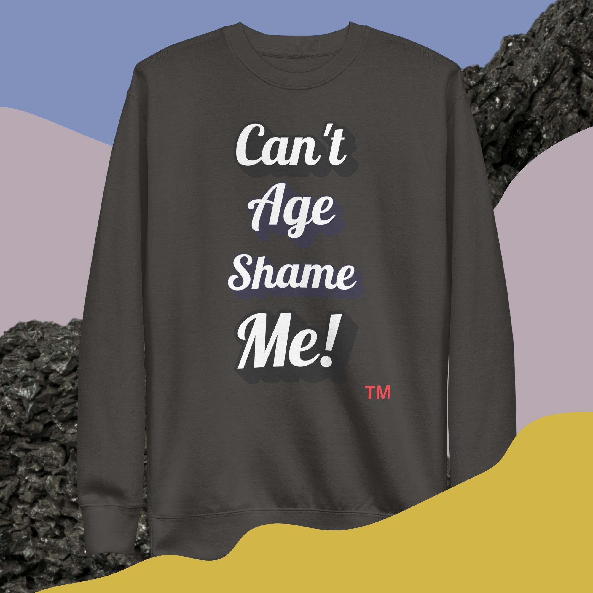 Black sweatshirt with 'Can't Age Shame Me!' text on a colorful abstract background