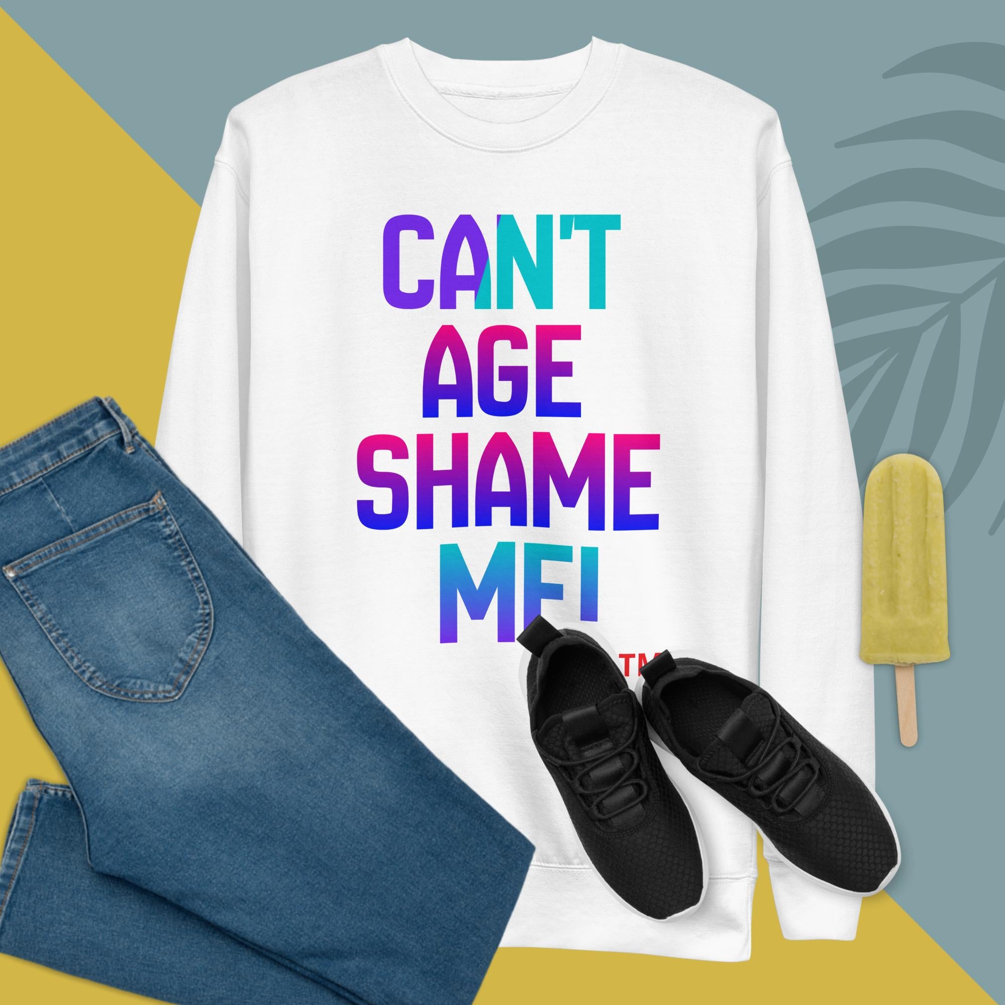 White sweatshirt with colorful text, blue jeans, black sneakers, and a popsicle on a geometric background