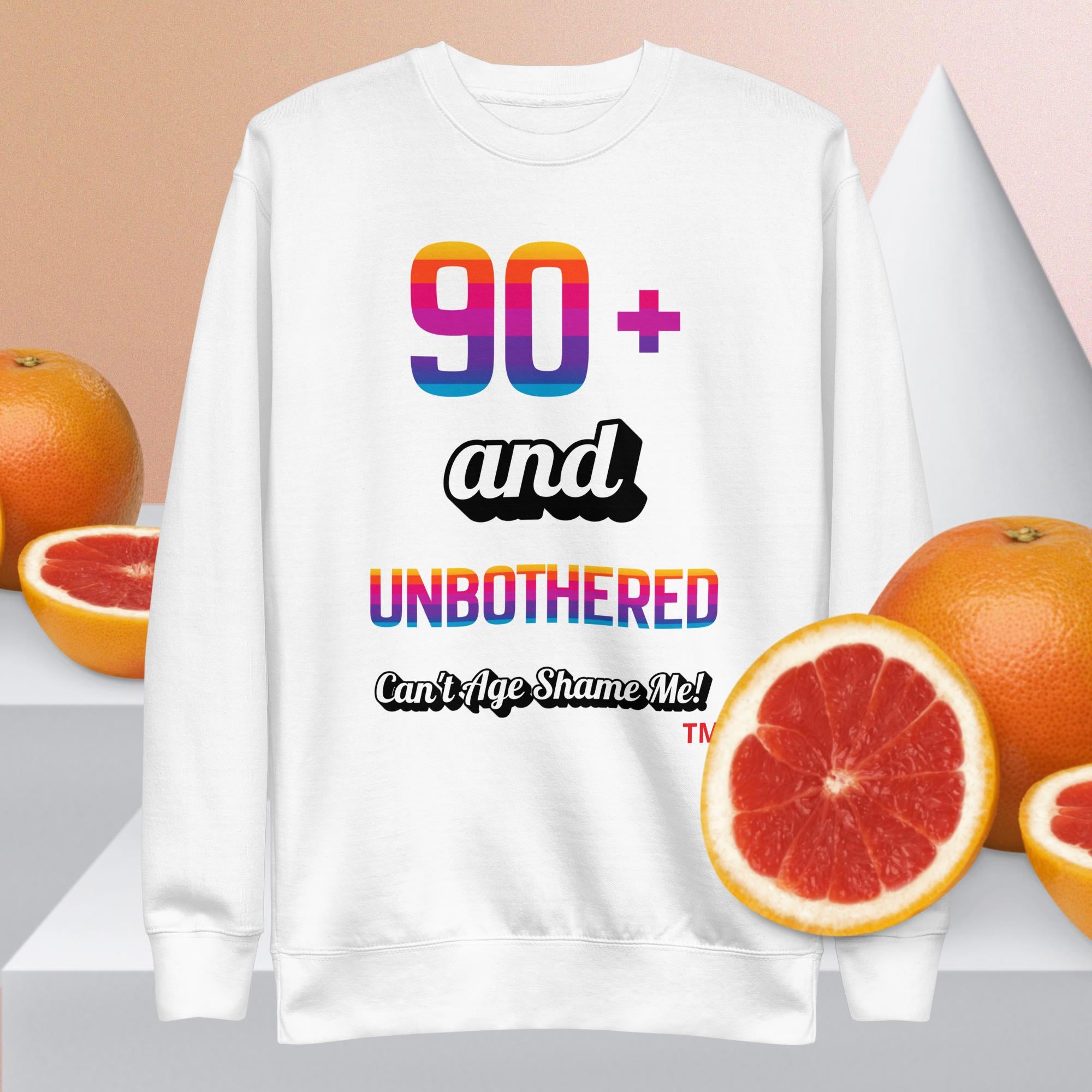 White sweatshirt with colorful text and grapefruits on a light background