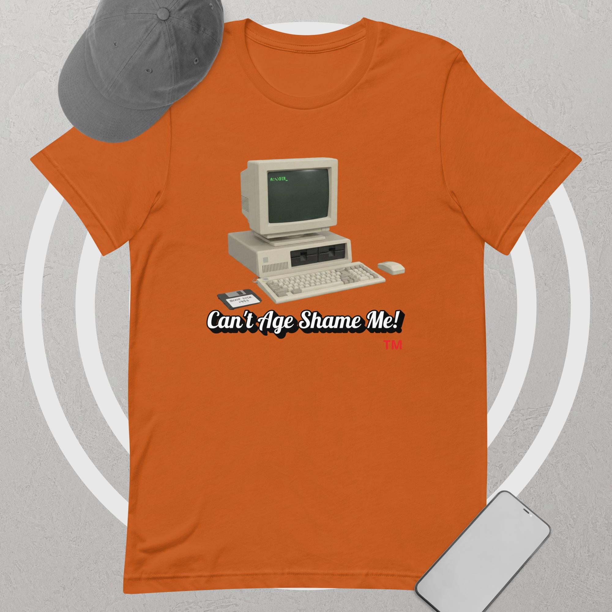 autumn t-shirt with vintage computer graphic and 'Can't Age Shame Me' text on a gray background
