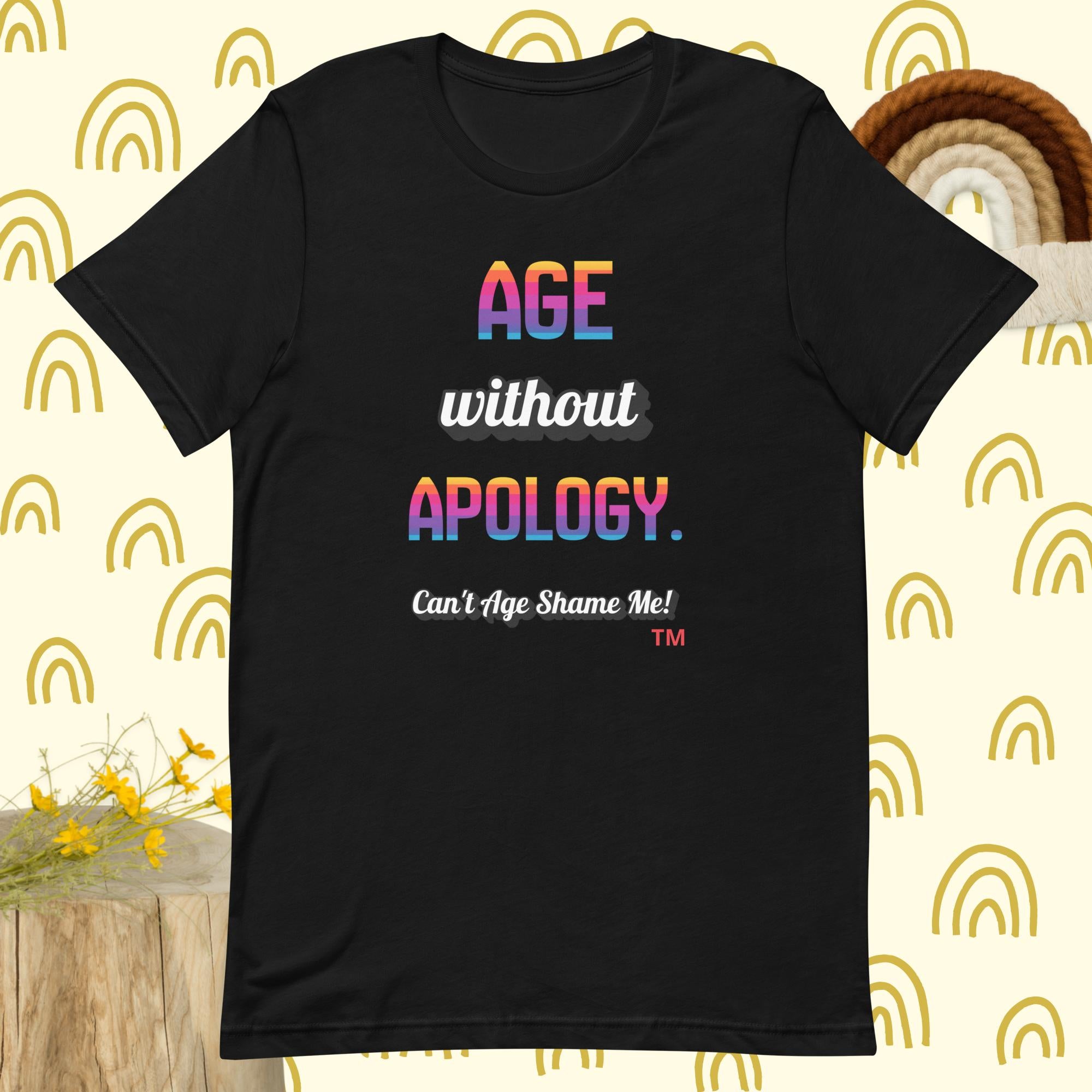 Black t-shirt with colorful text on a patterned background