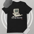 Black t-shirt with vintage computer graphic and text 'Can't Age Shame Me!' on a gray background.