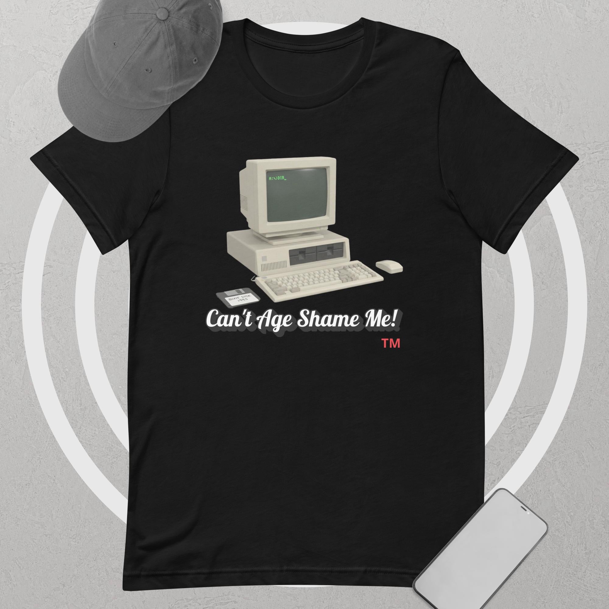 Black t-shirt with vintage computer graphic and text 'Can't Age Shame Me!' on a gray background.