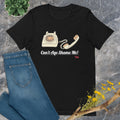 Black t-shirt with vintage phone graphic and 'Can't Age Shame Me!' text on a gray surface with jeans and flowers.