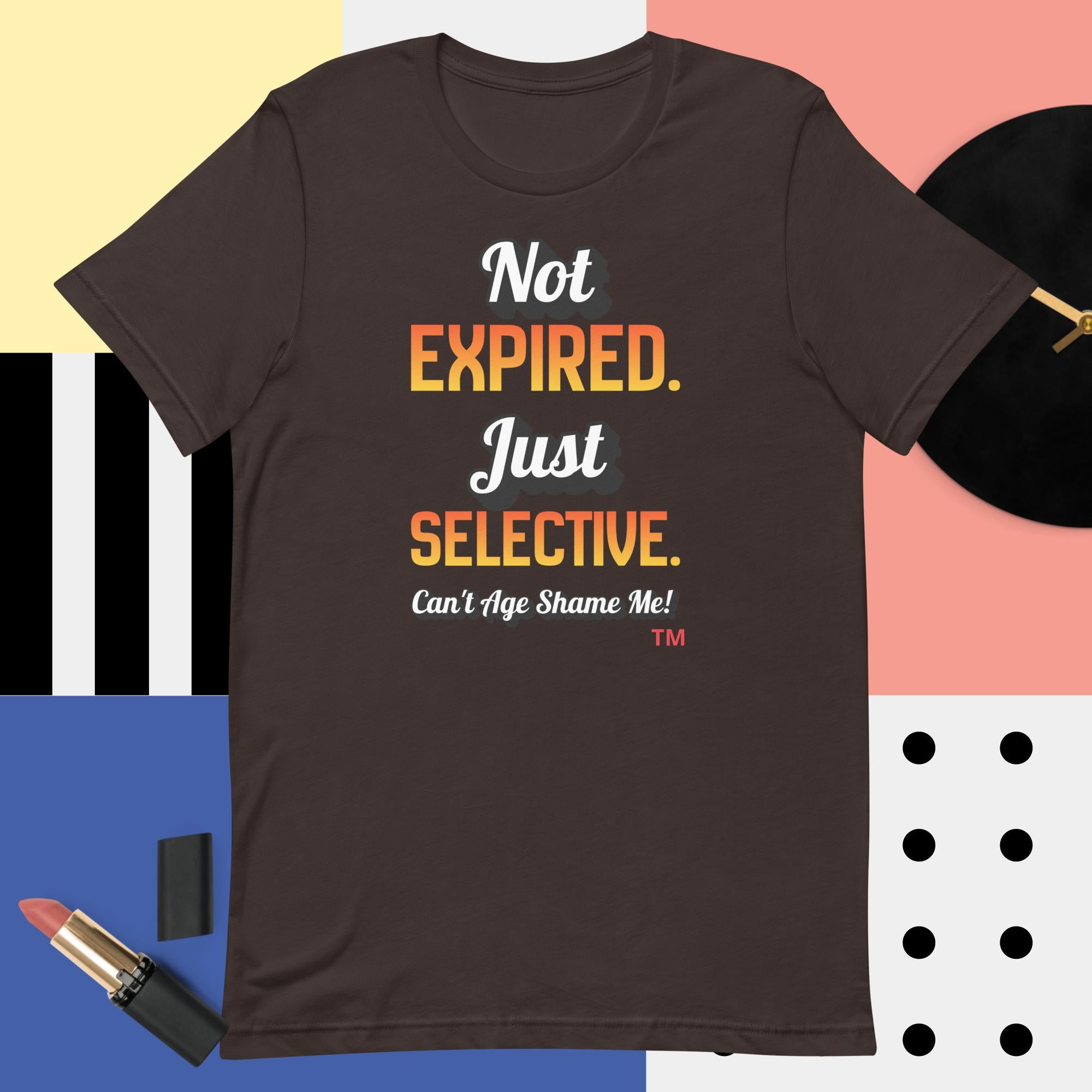 Brown t-shirt with colorful text on a multicolored background