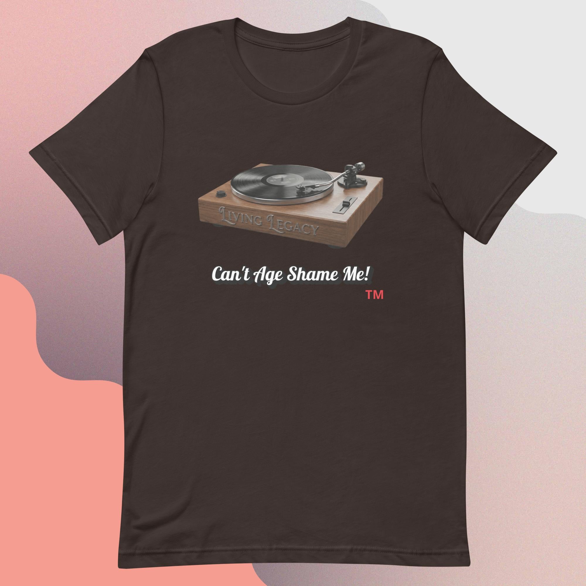 Brown t-shirt with a graphic of a turntable and text 'Can't Age Shame Me!' on a gradient background