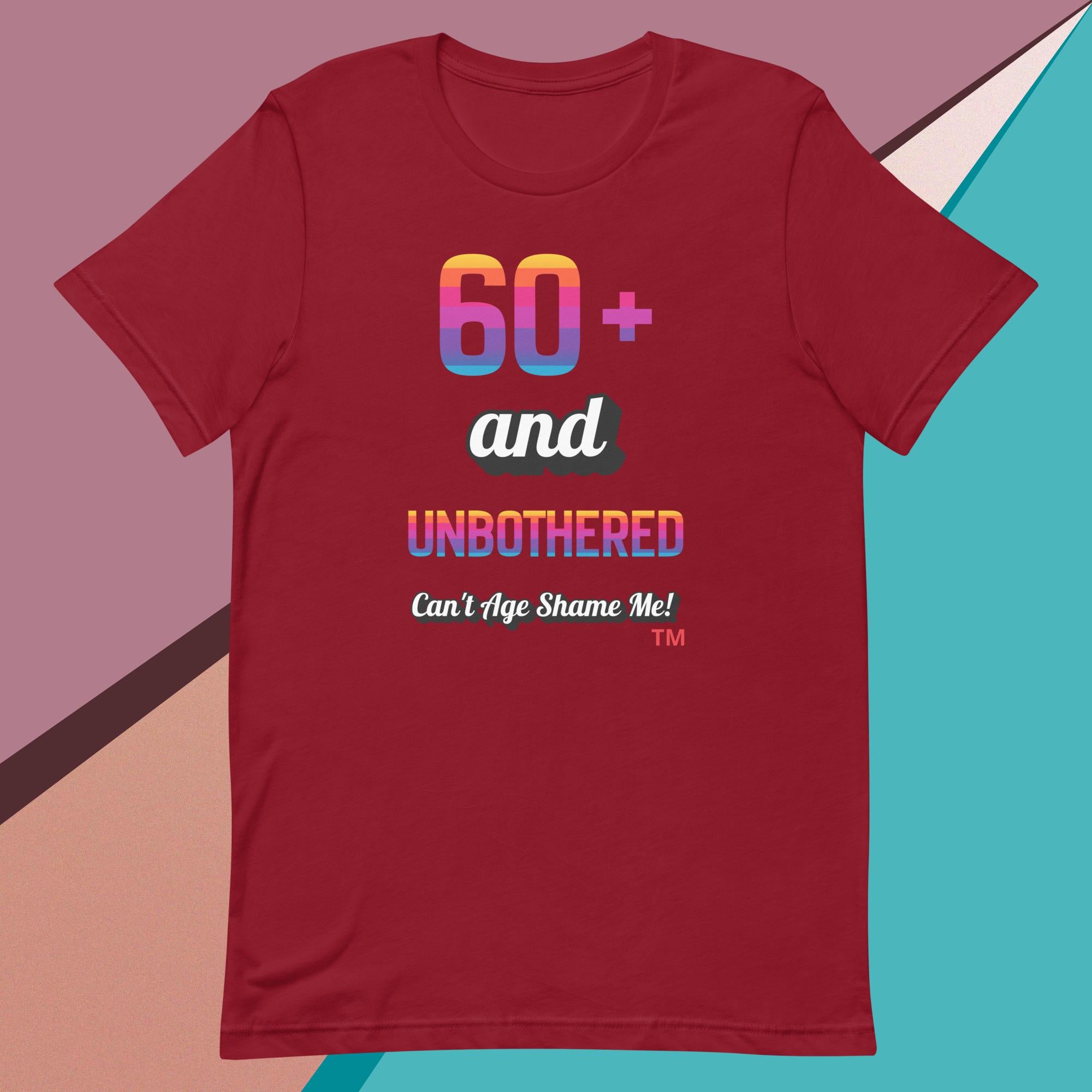 Red t-shirt with colorful text design on a geometric background