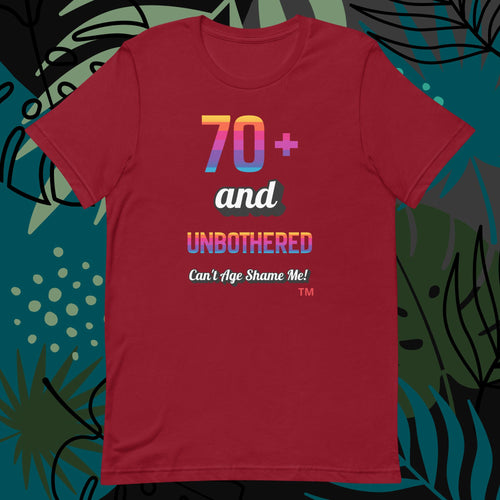 Red t-shirt with colorful text design on a decorative background
