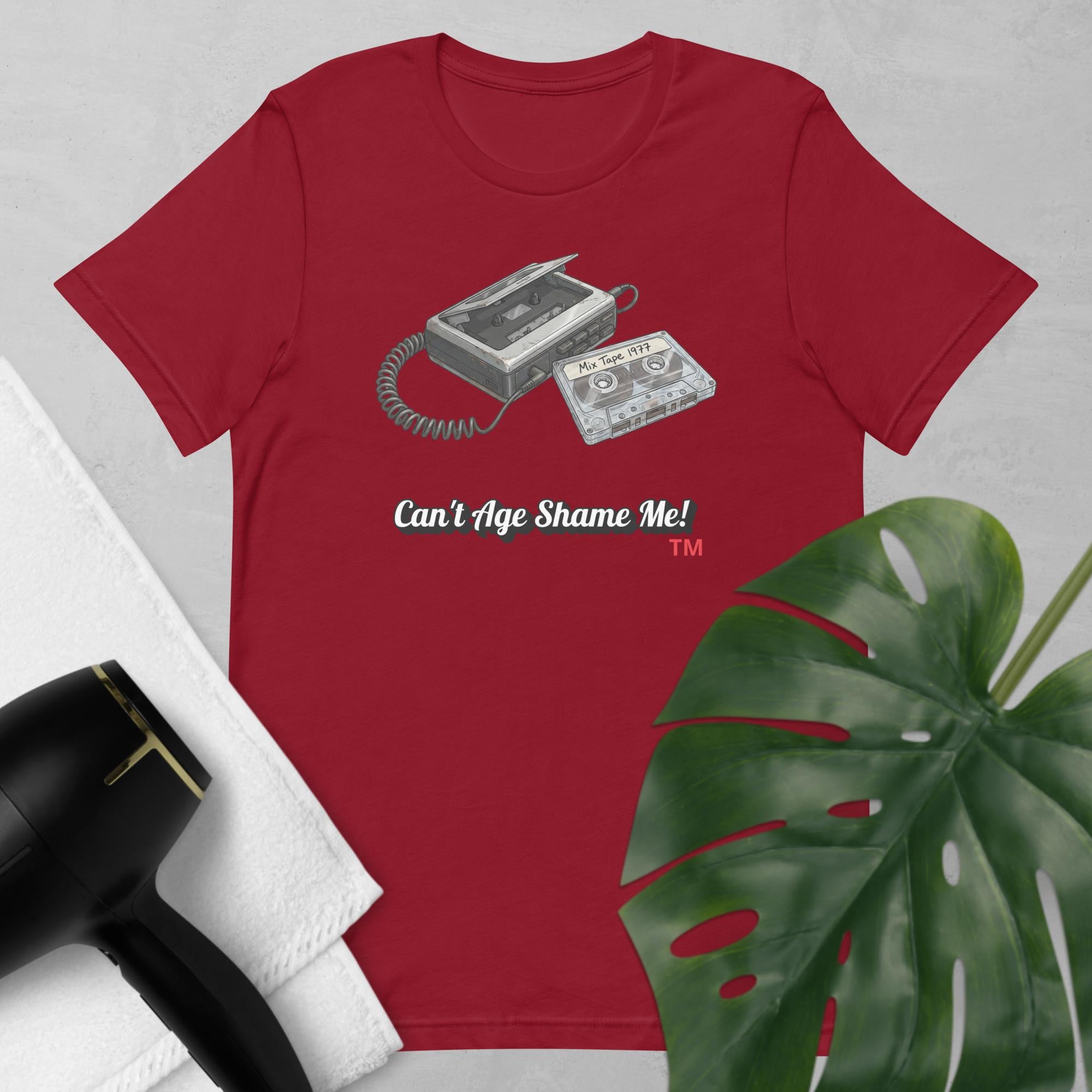 cardinal  t-shirt with cassette tape design and text 'Can't Age Shame Me!' on a light gray background.