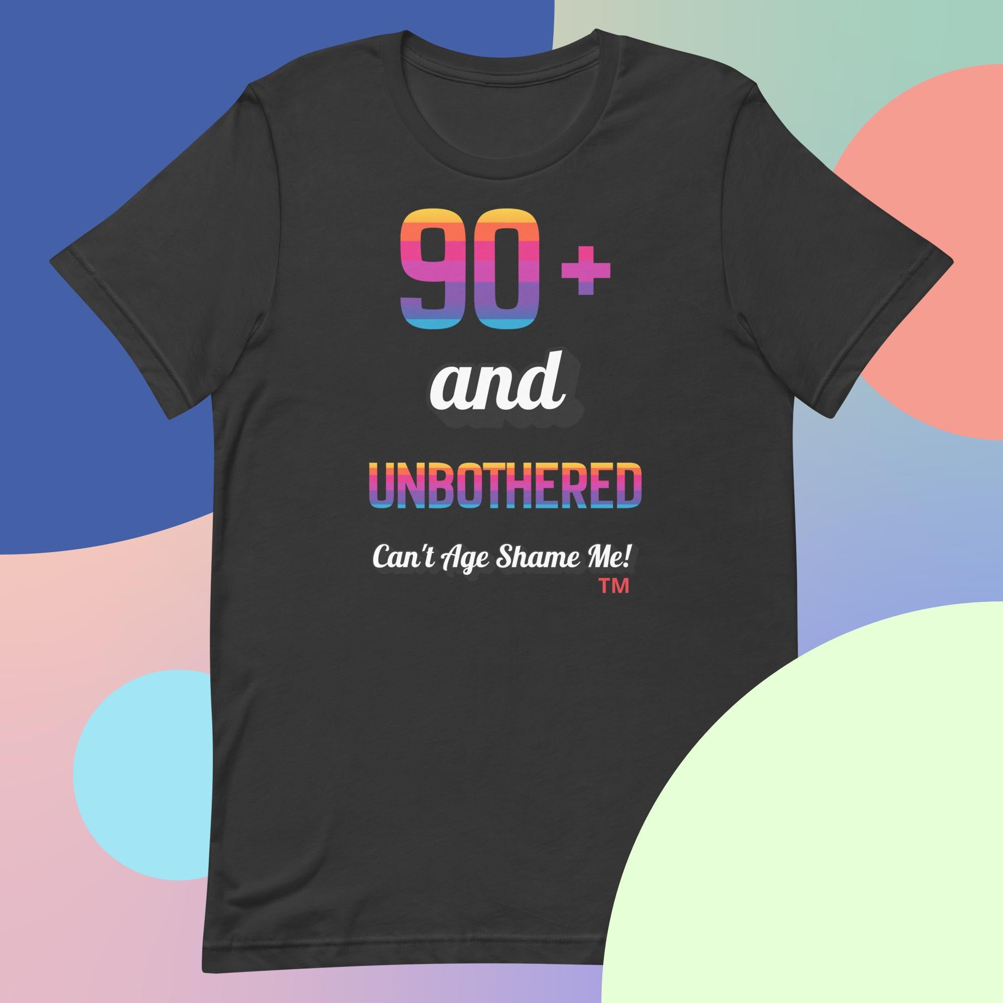 Dark gray t-shirt with colorful text design on a multicolored background