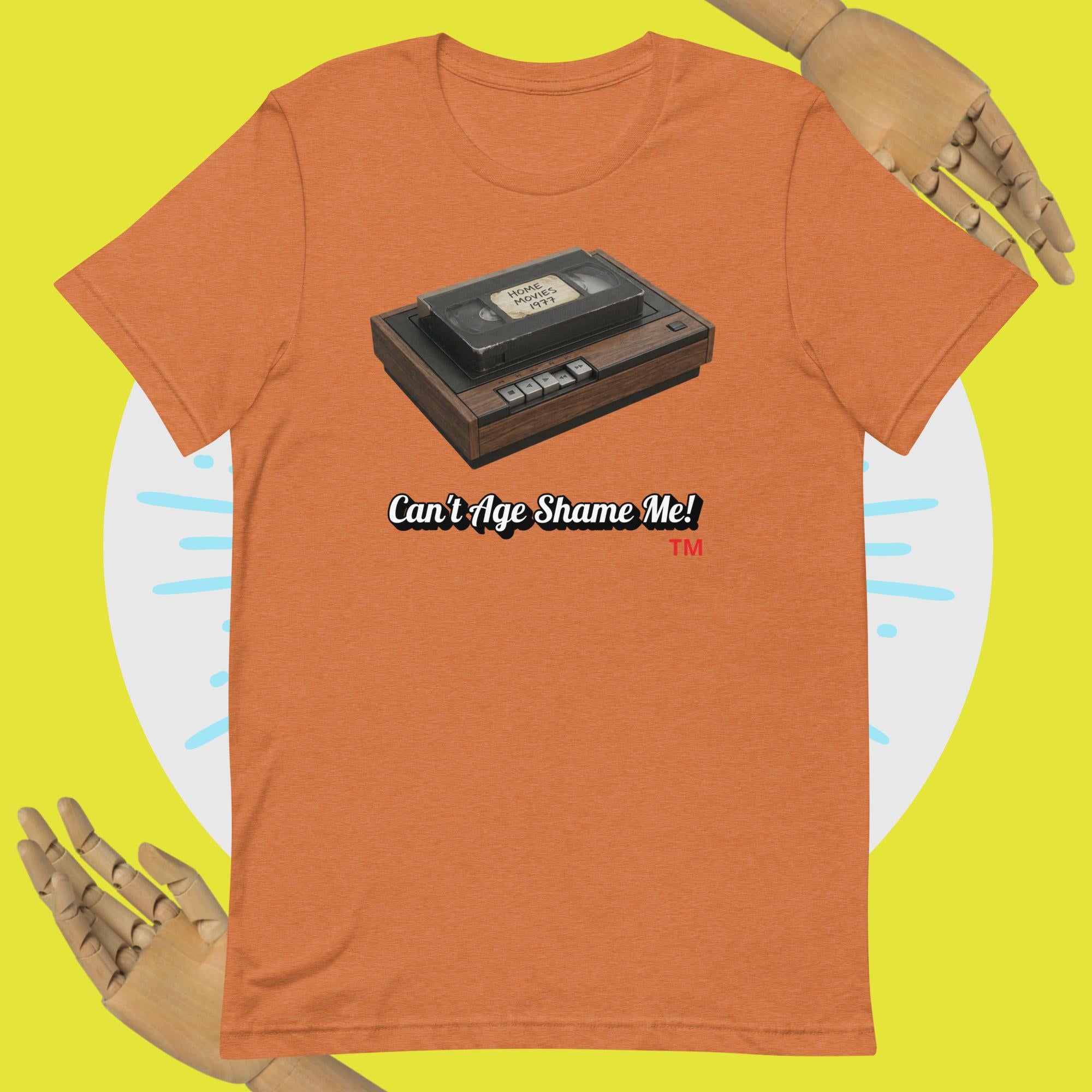 heather autumn t-shirt with a cassette tape graphic and 'Can't Age Shame Me!' text on a yellow background.